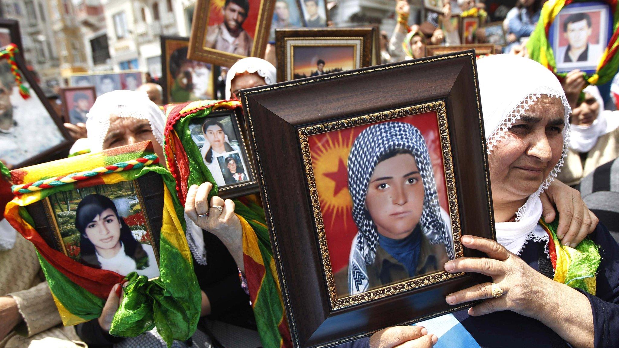 File picture of Turkish Kurdish women holding pictures of their loved ones who were killed in clashes between Kurdistan Workers Party (PKK) guerrillas and Turkish security forces, during a 2011 demonstration in Istanbul