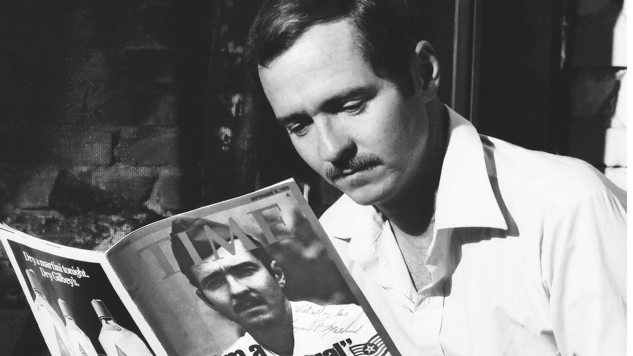 Leonard Matlovich reading about himself in Time magazine