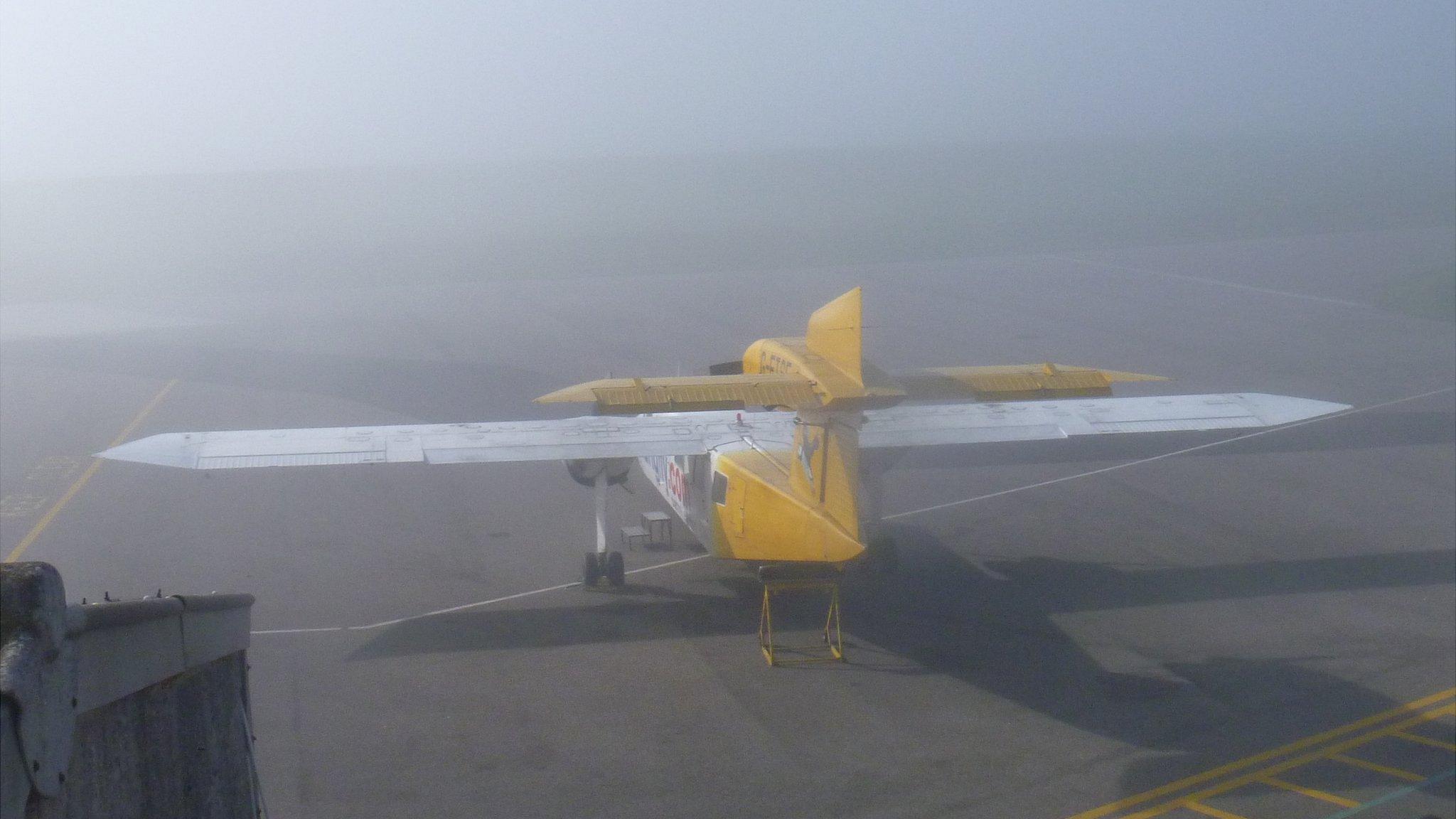 Plane at Alderney Airport in fog