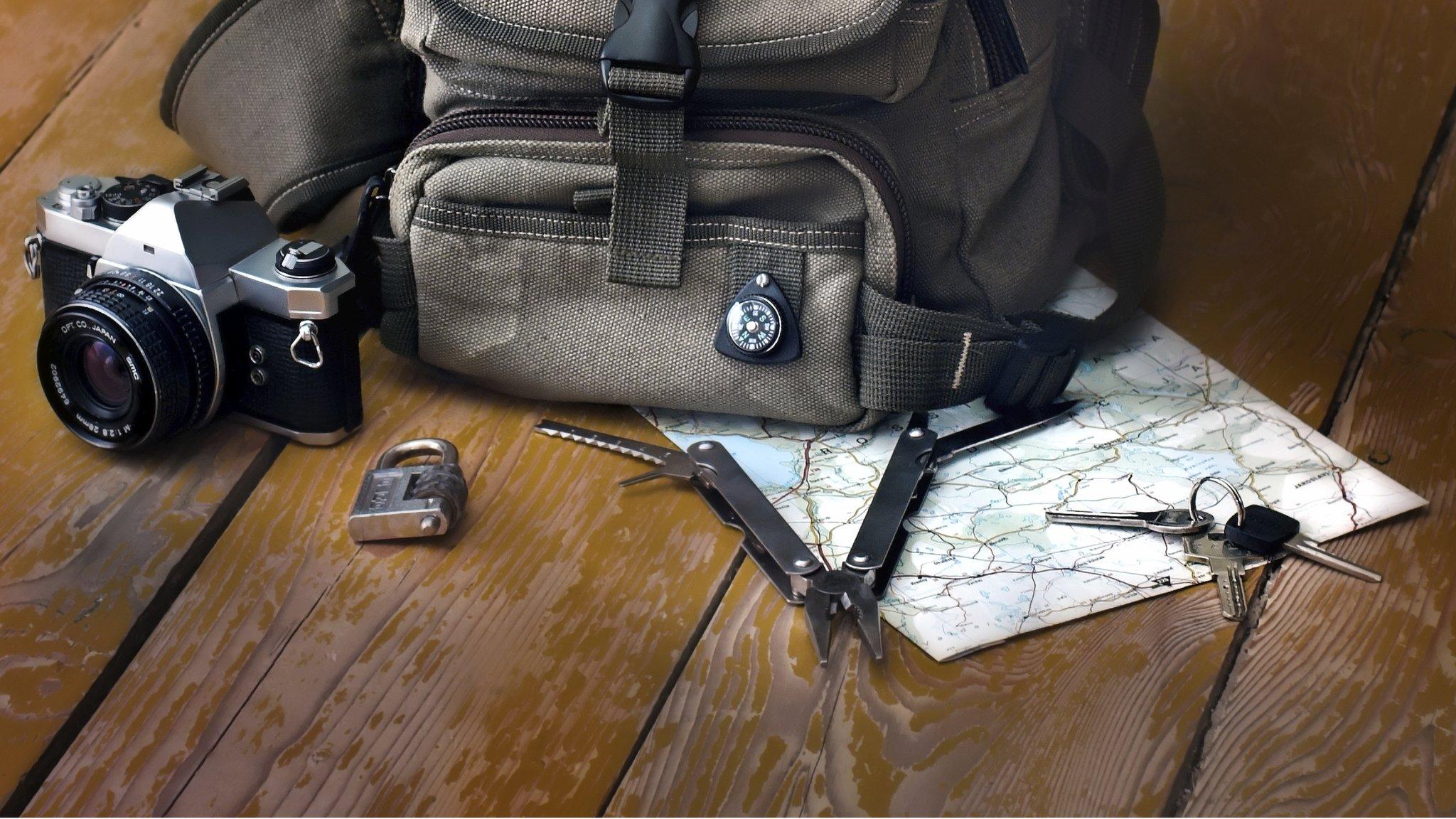 Backpack, camera, compass, multi-tool