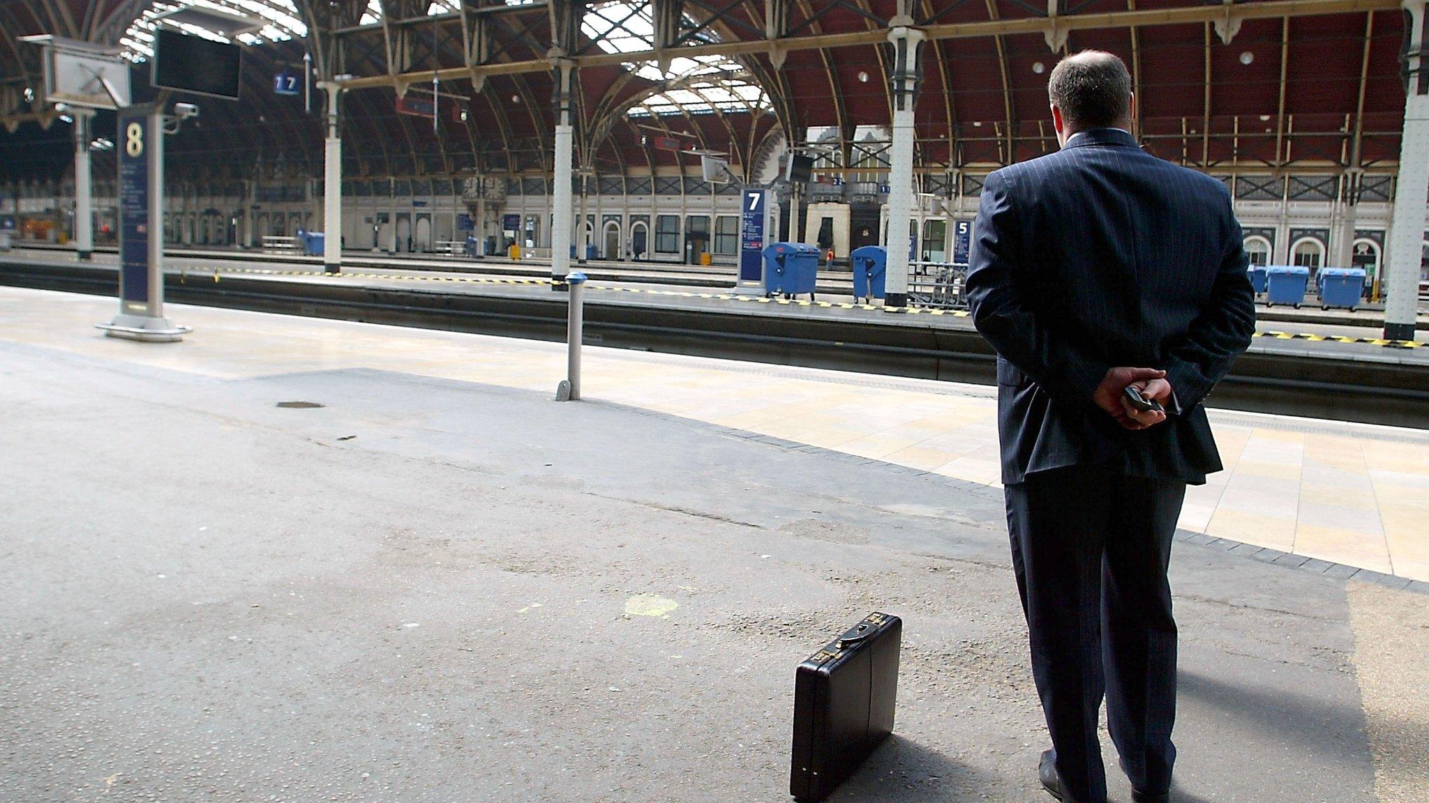 Lone man at train station