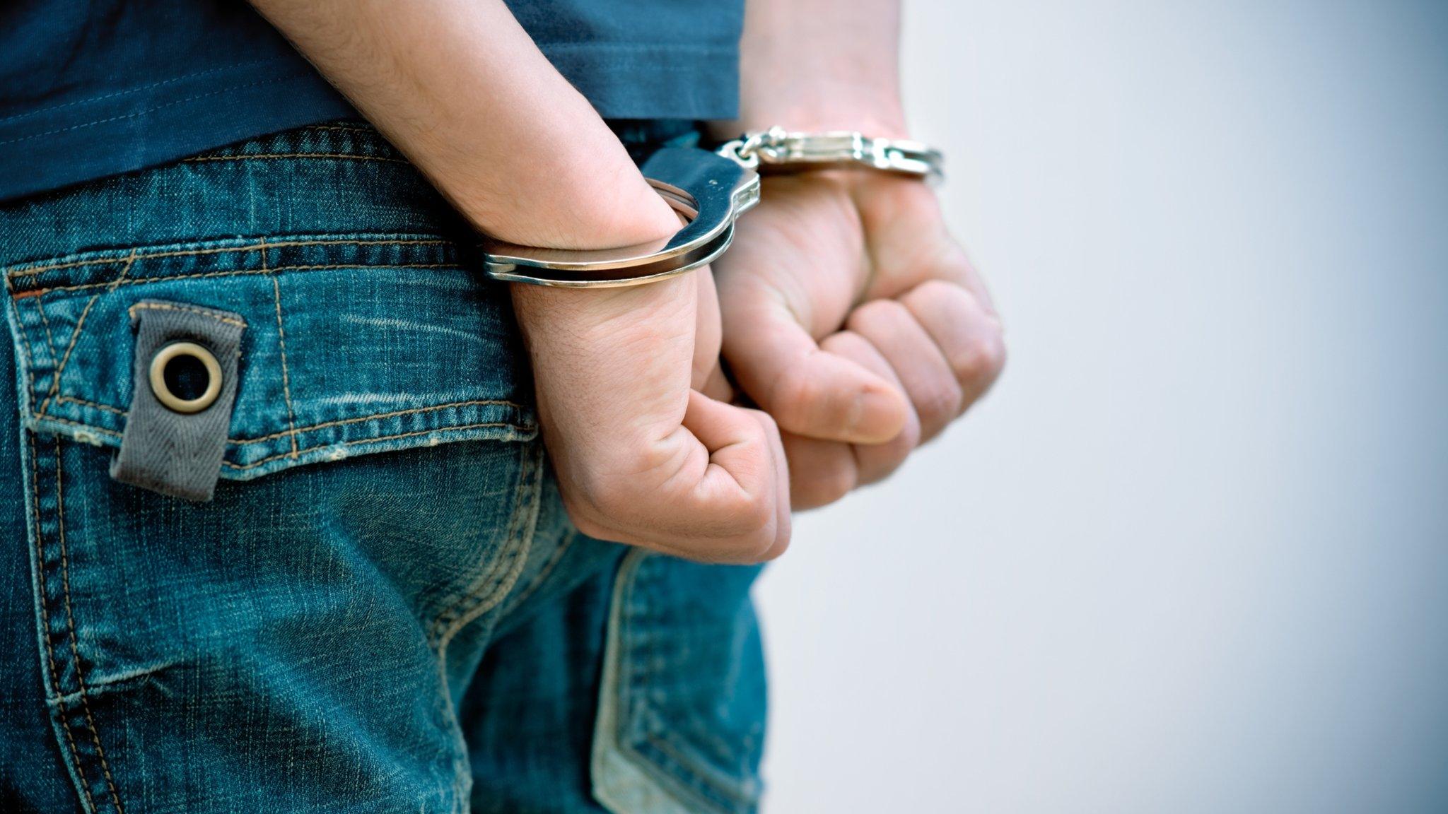 Teenager in handcuffs