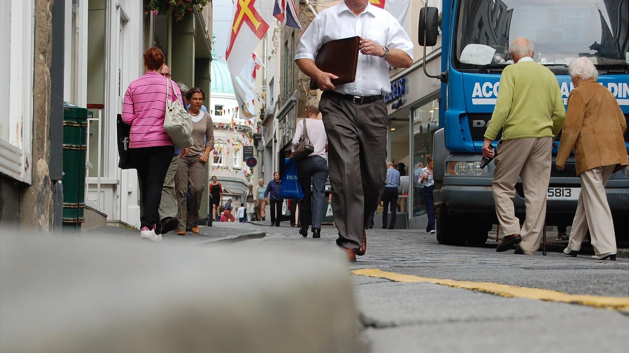 People walking in the High Street in St Peter Port