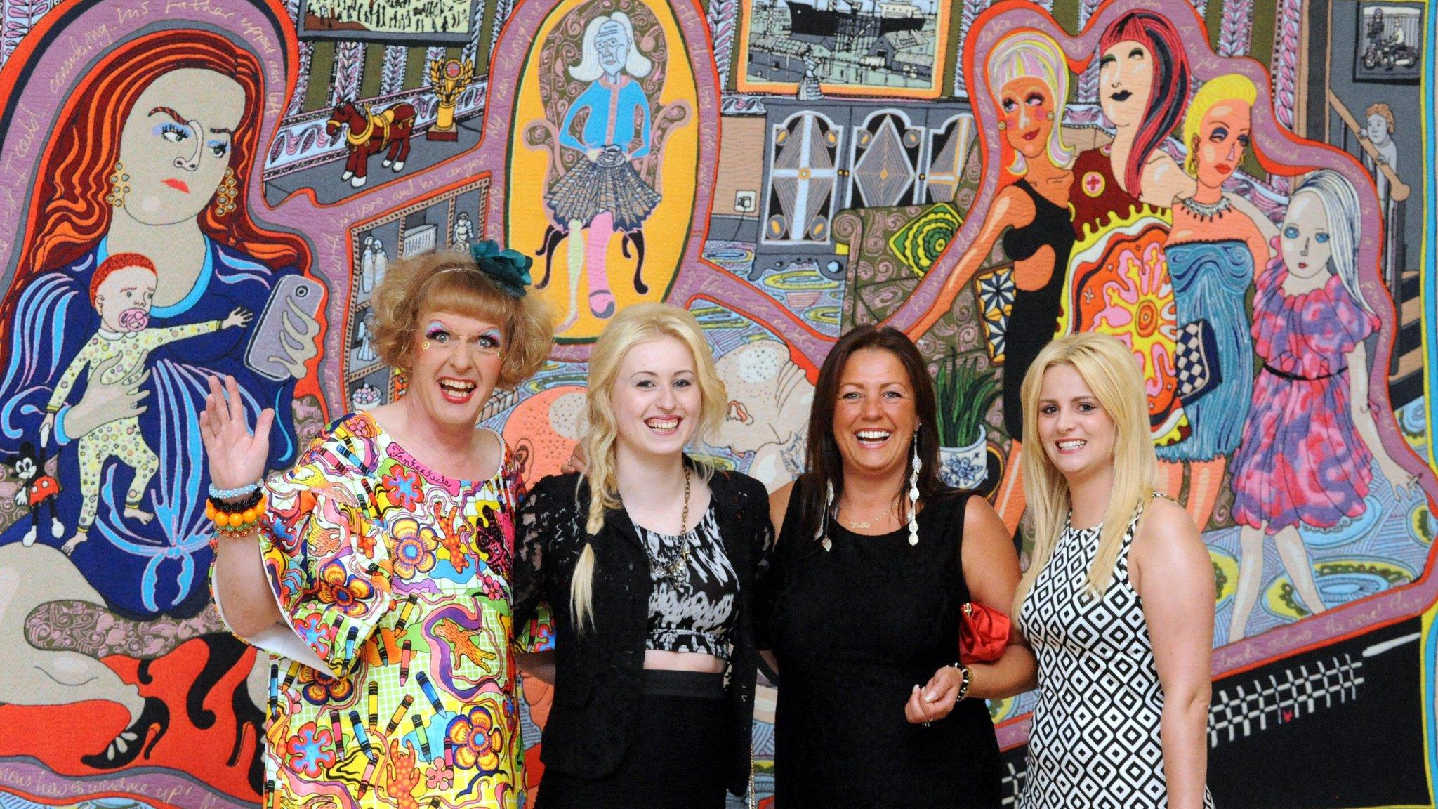 Grayson Perry, with three of the women featured in "the Adoration of the Cage Fighters"