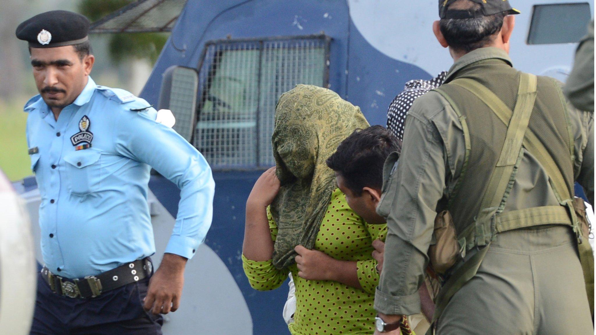 Pakistani security personnel move Rimsha Masih (2L), a Christian girl accused of blasphemy, to a helicopter after her release from jail in Rawalpindi on September 8, 2012.