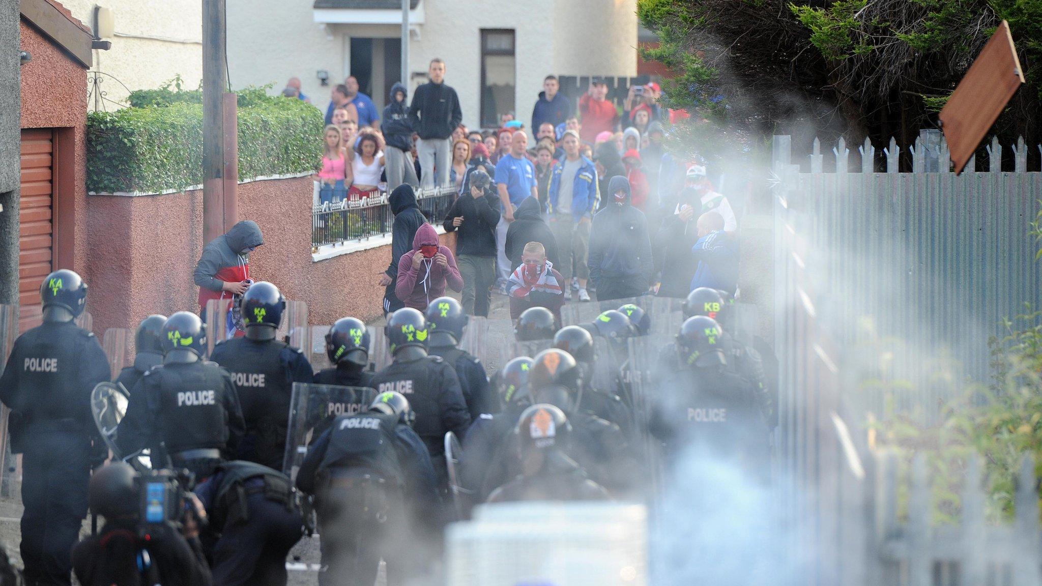 Heavily armed PSNI officers stand firm as serious trouble broke out on Saturday night