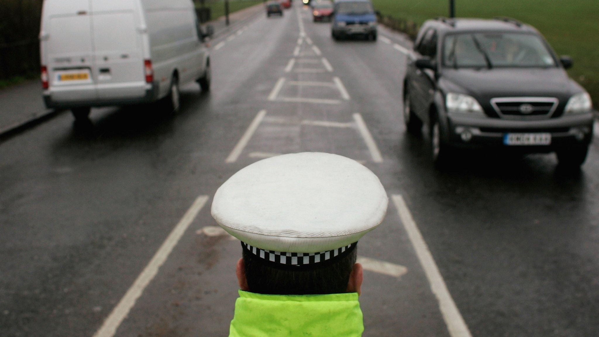 Police officer monitoring traffic