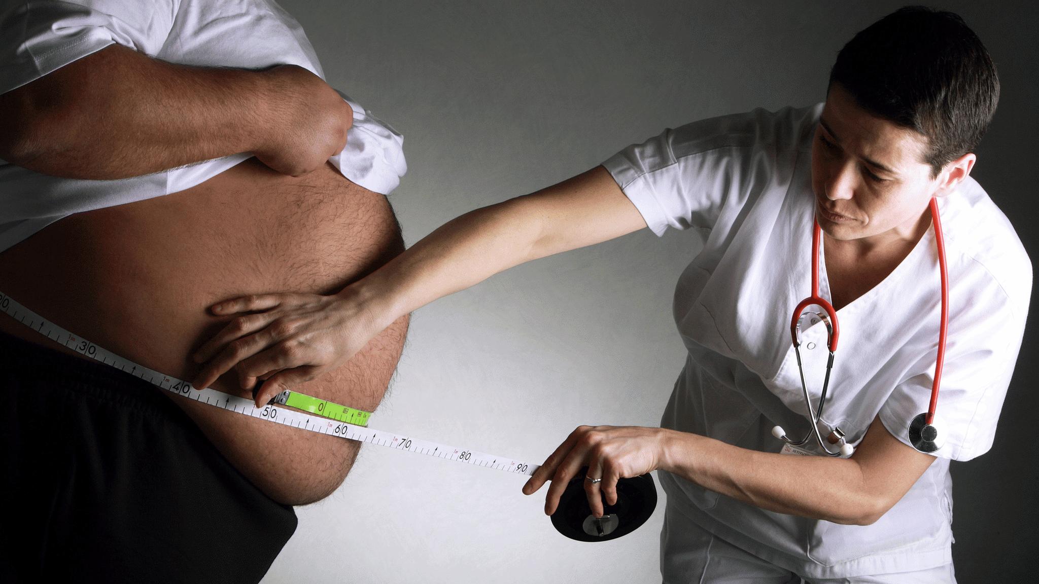 Obese person being measured