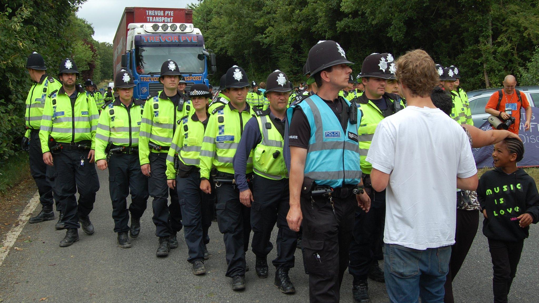 Police escort lorry into site