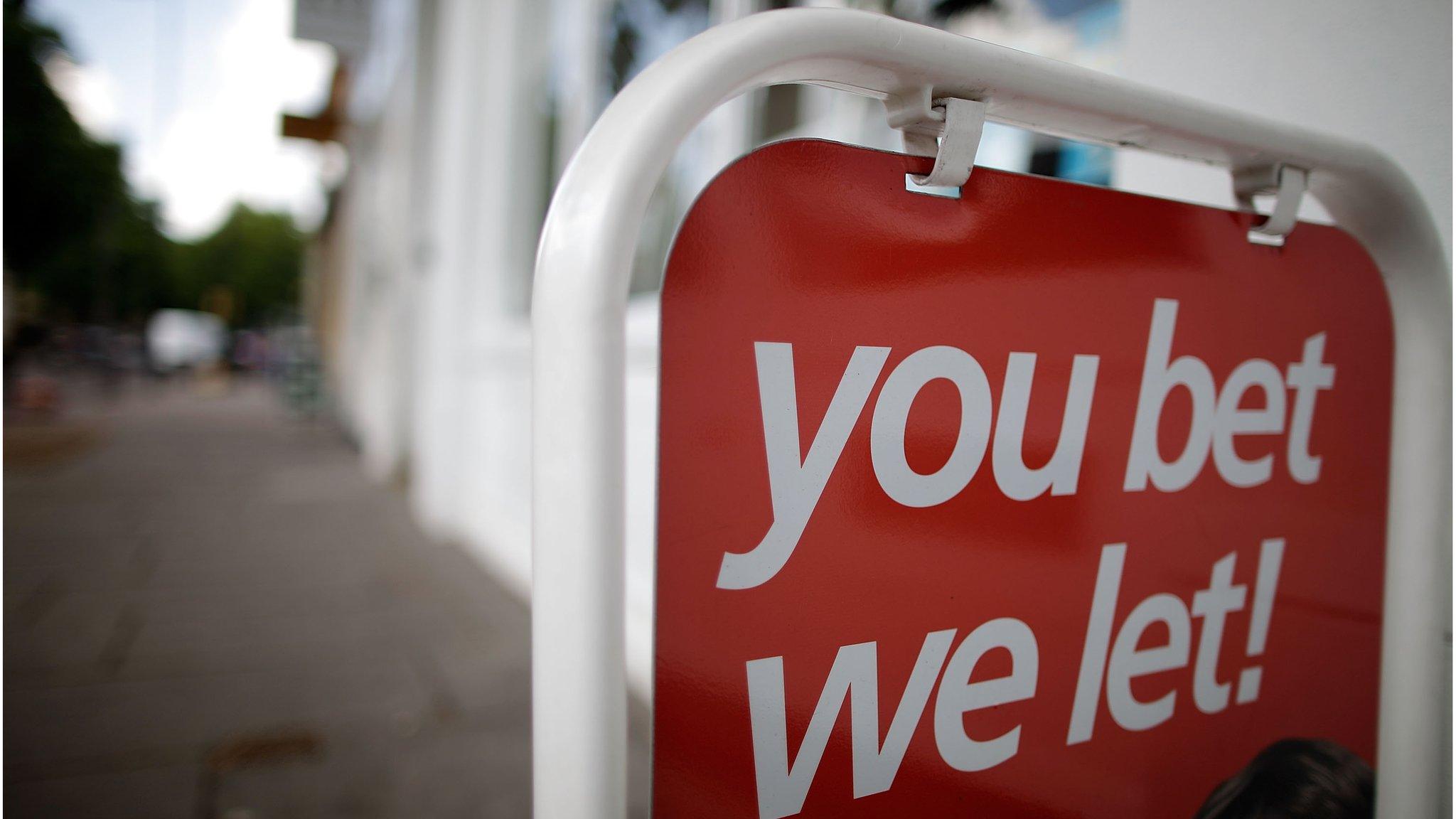 A sign advertising the opportunity to let hangs outside a branch of Barnard Marcus estate agents in Kennington, London.