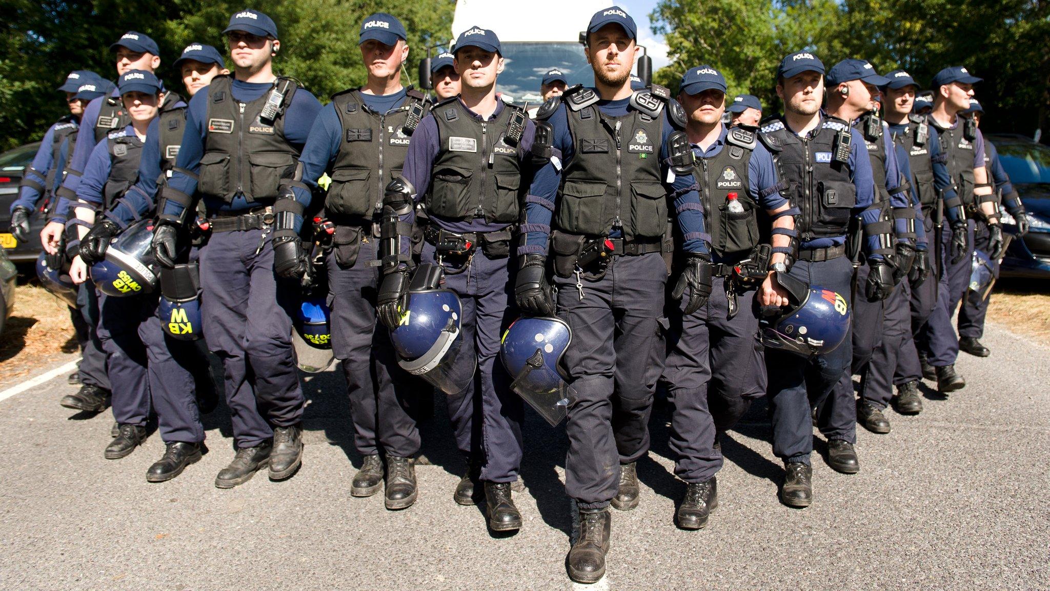 Police guard lorry entering site