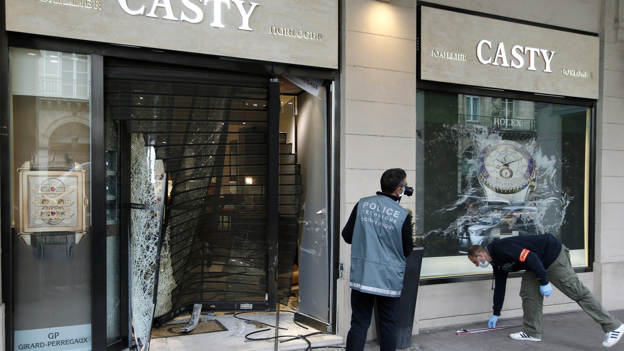 French police investigate the scene of a night raid at a jewellery shop in Place Vendome, Paris