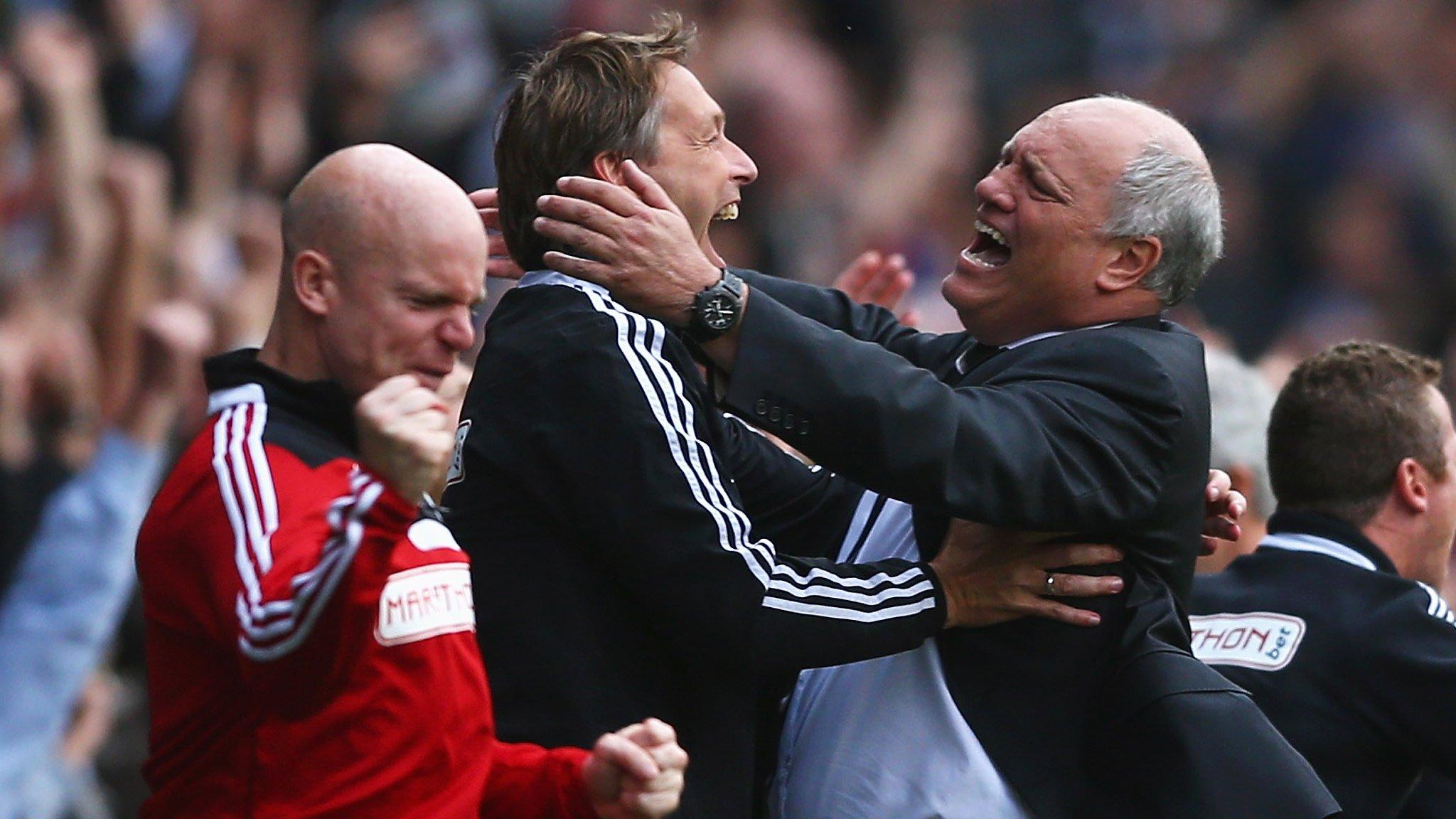 Fulham manager Martin Jol (right) celebrates his side's winning goal against Stoke