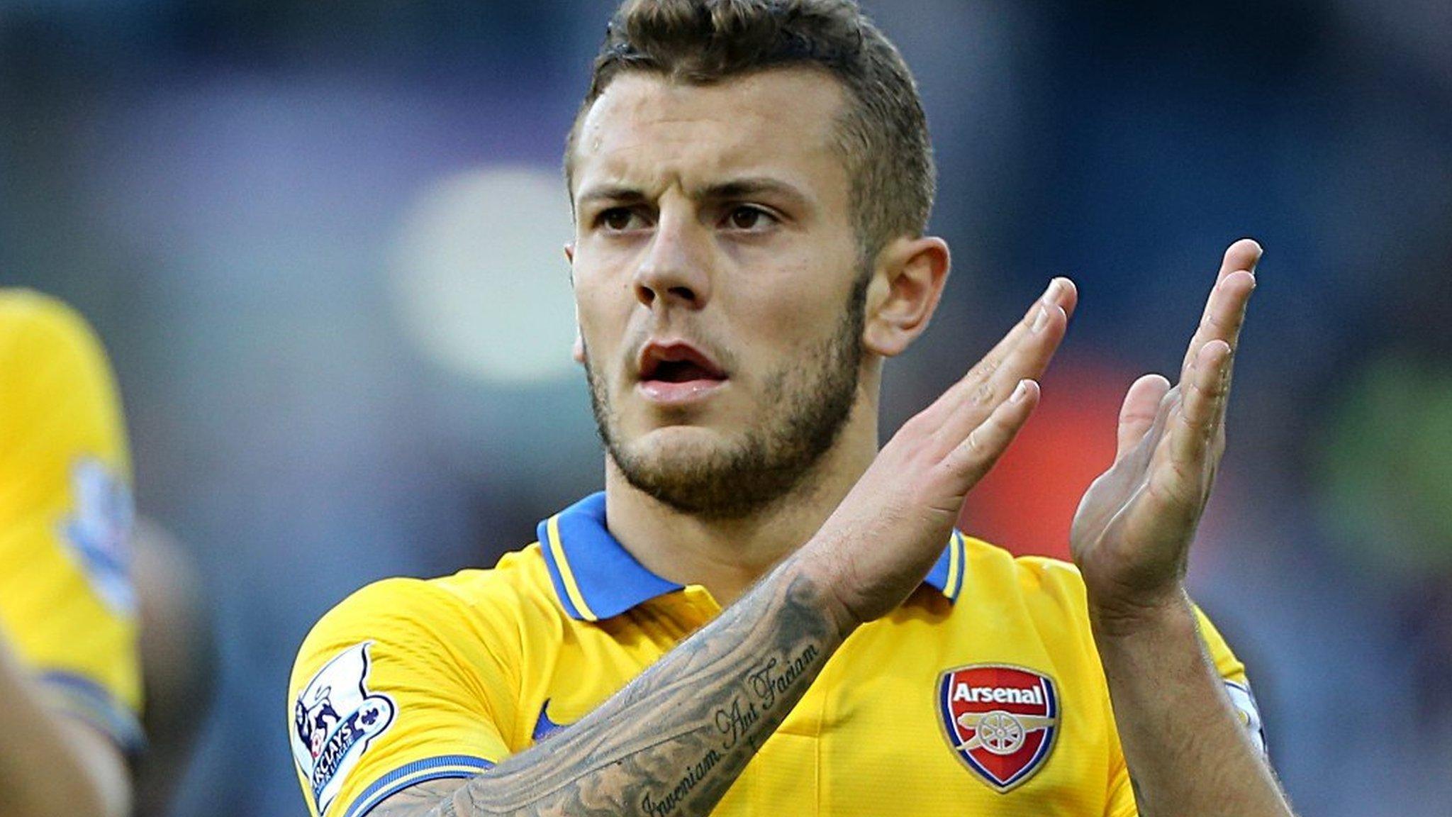 Arsenal midfielder Jack Wilshere applauding his side's fans after the game against West Brom