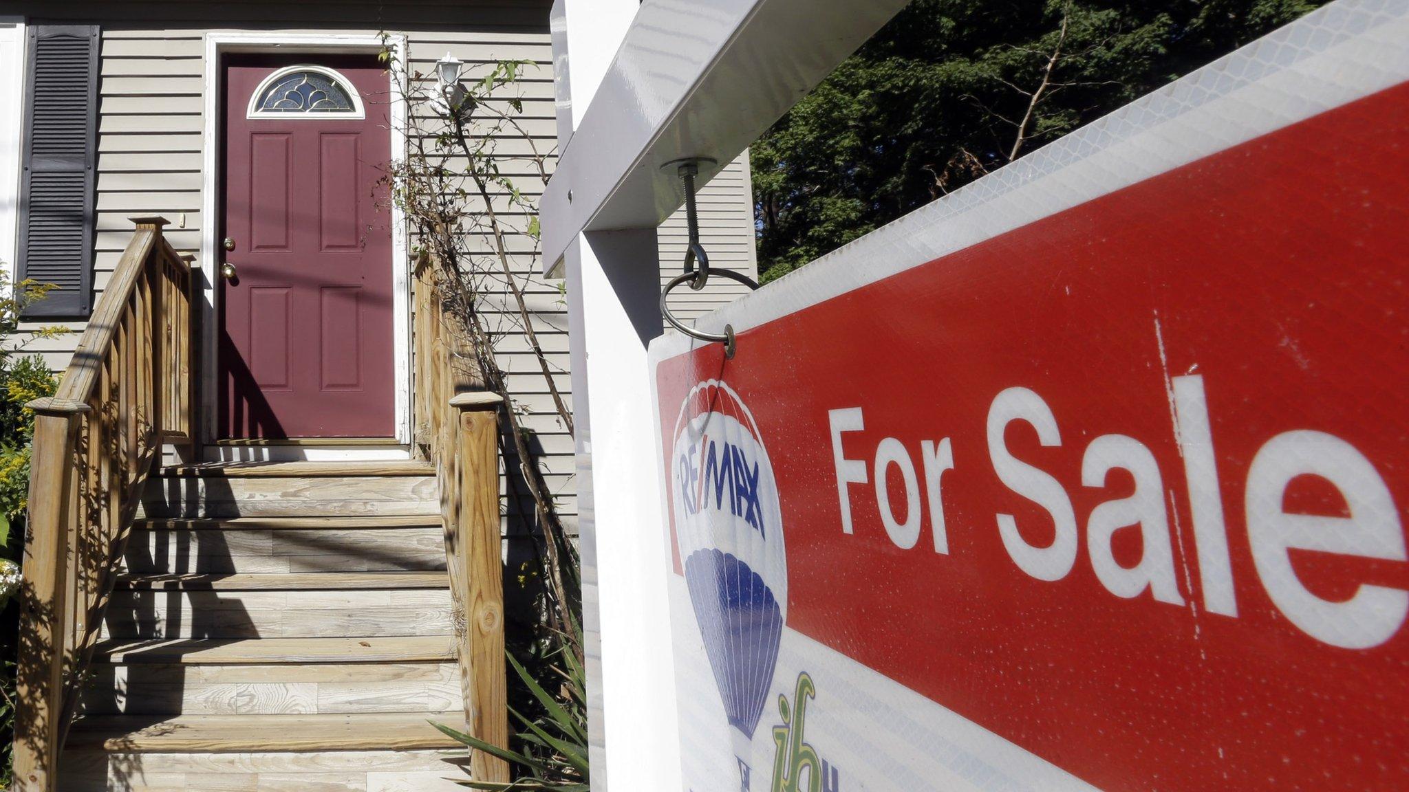 For sale sign outside a house