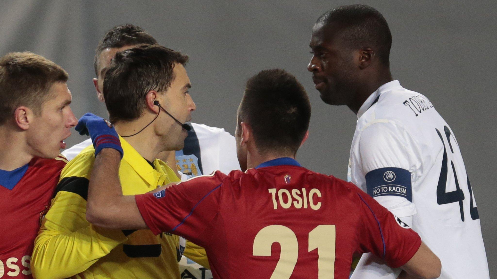 Manchester City"s Yaya Toure (r) speaks to the referee Ovidiu Hategan (l) during the Champions League match between CSKA Moscow and Manchester City