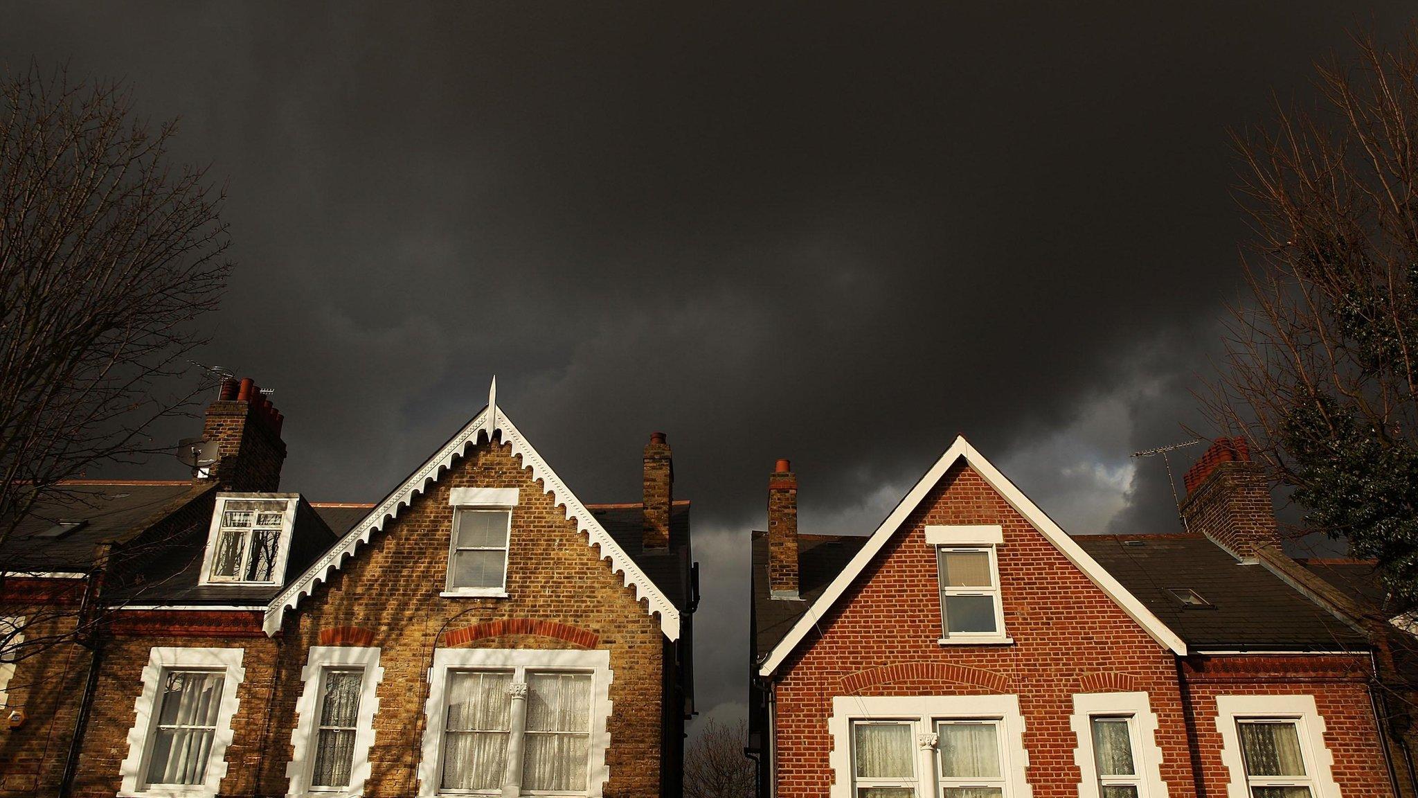 Storm clouds over rooftops in London (library image)