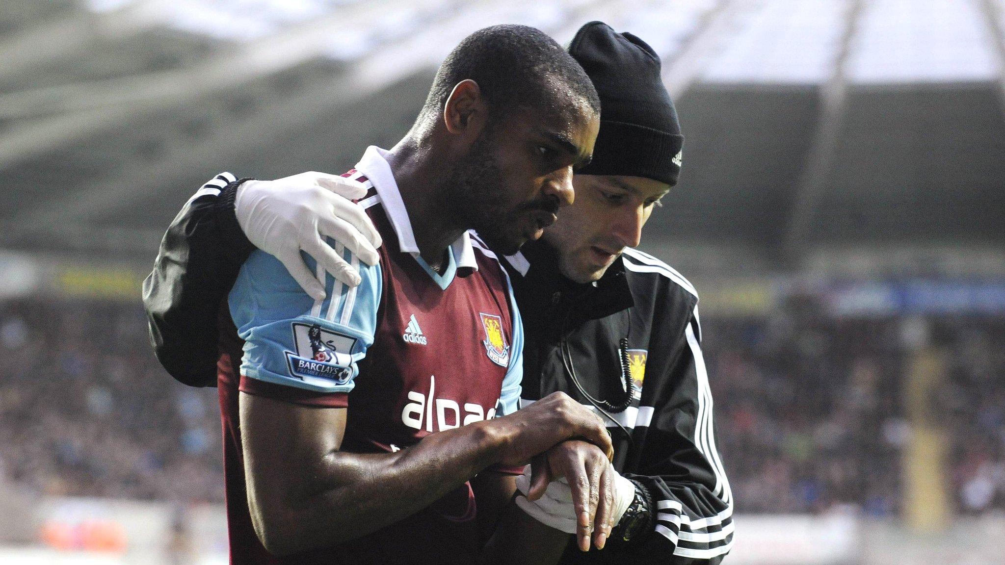 West Ham's goes off during the game against Swansea