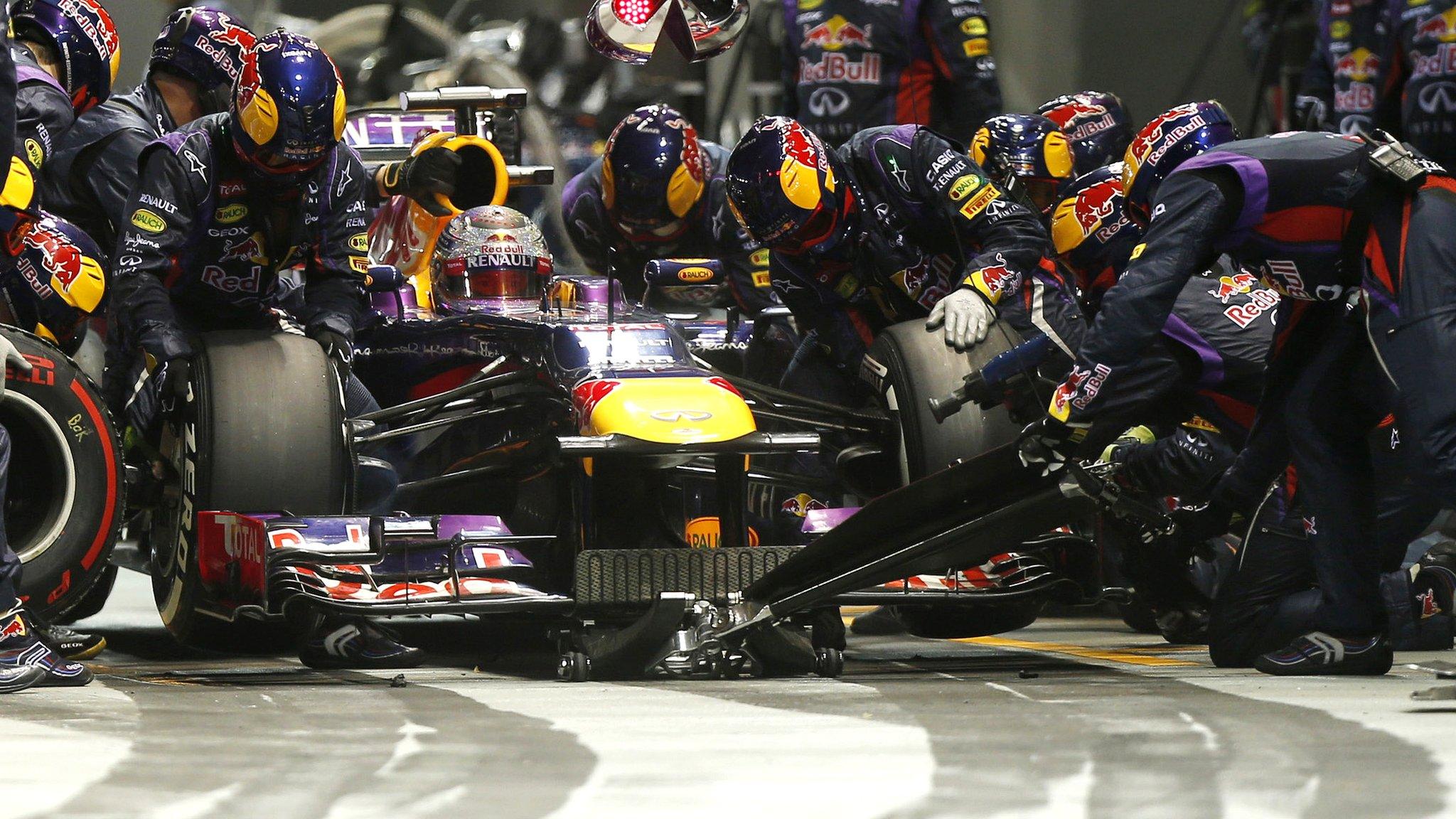 Sebastian Vettel having tyres changed