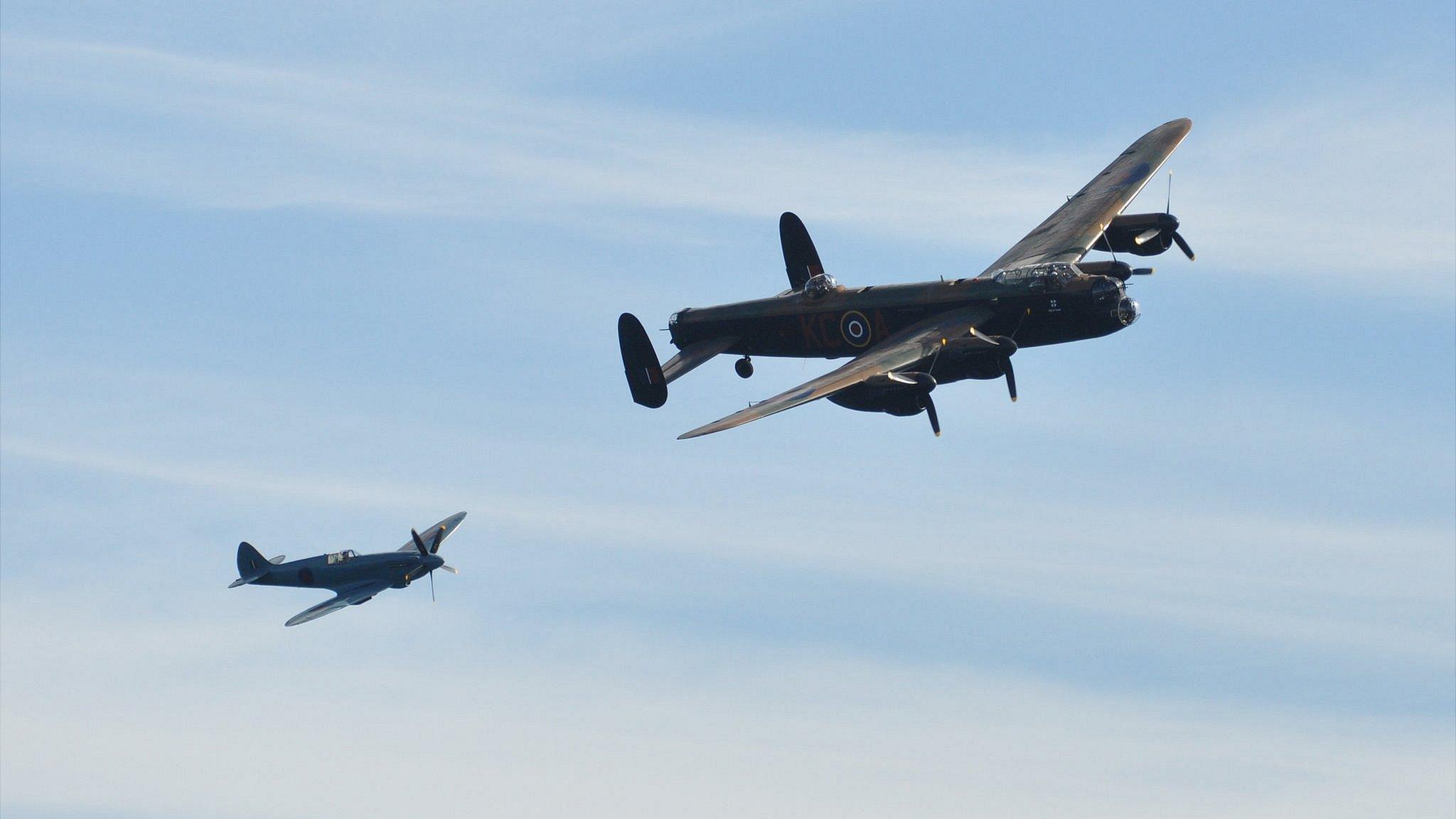 Battle of Britain Memorial Flight Lancaster and Spitfire taking part in Guernsey's air display in 2012