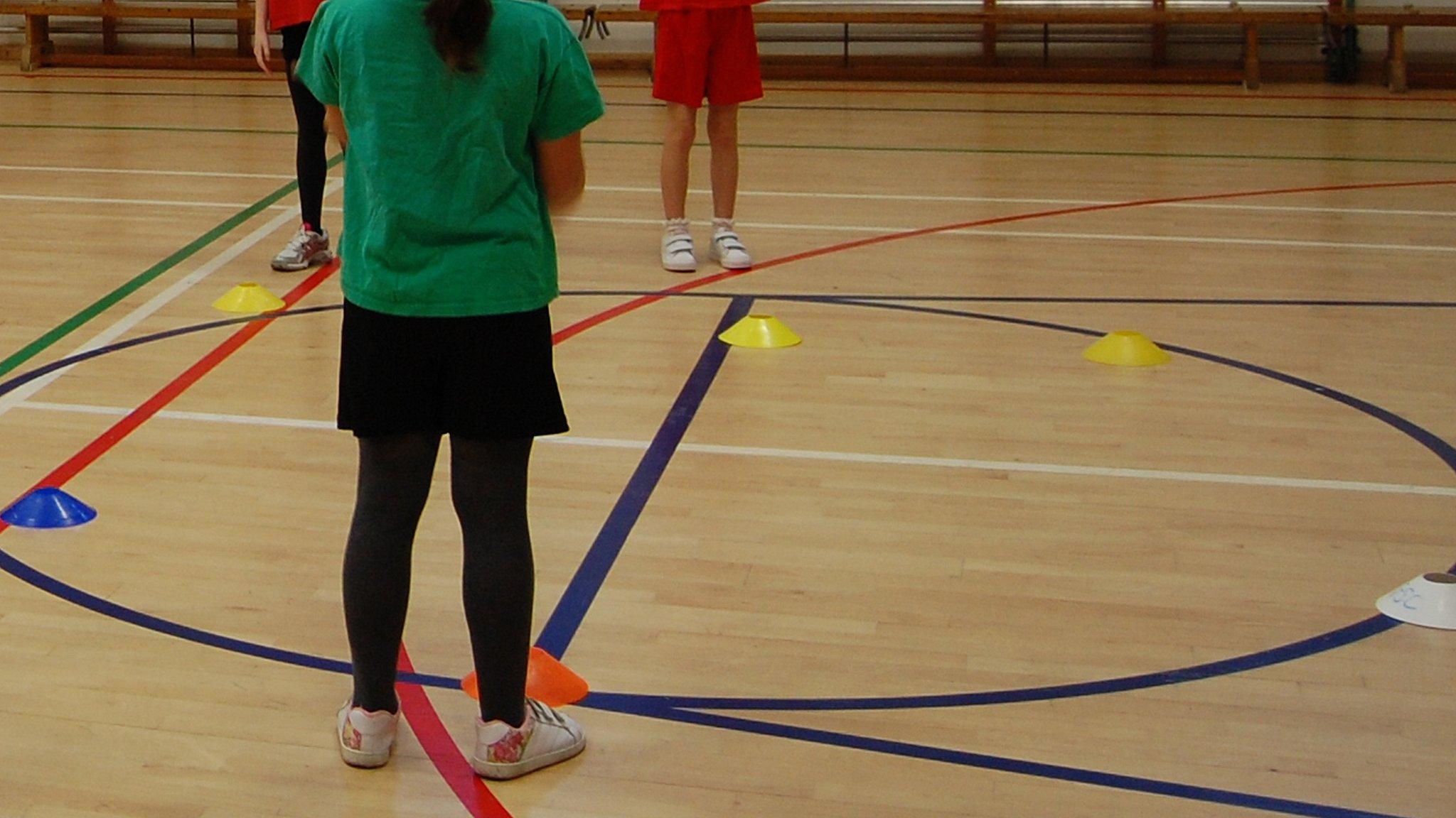 Children playing in a sports hall