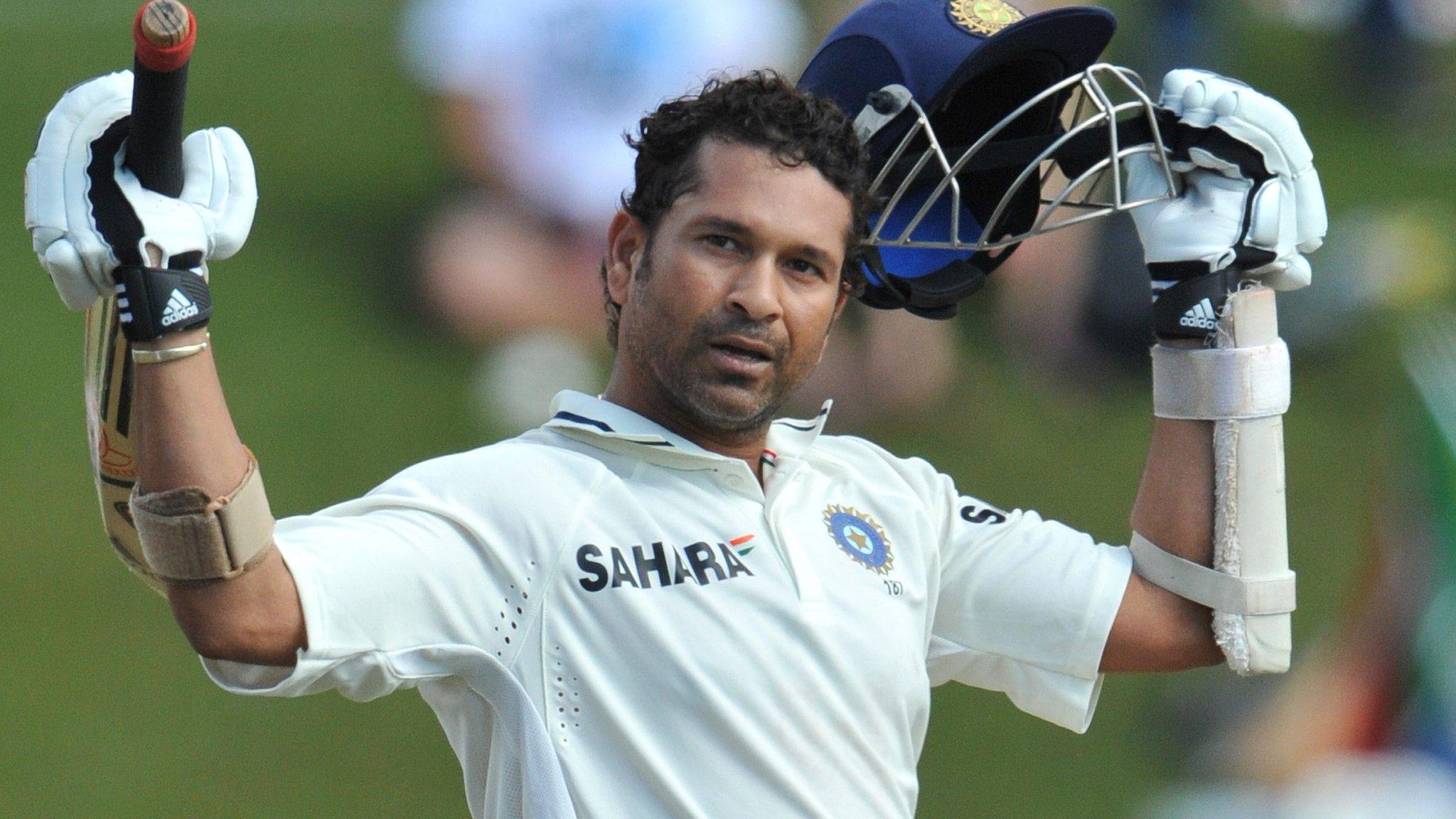 Sachin Tendulkar acknowledges the crowd after scoring a century