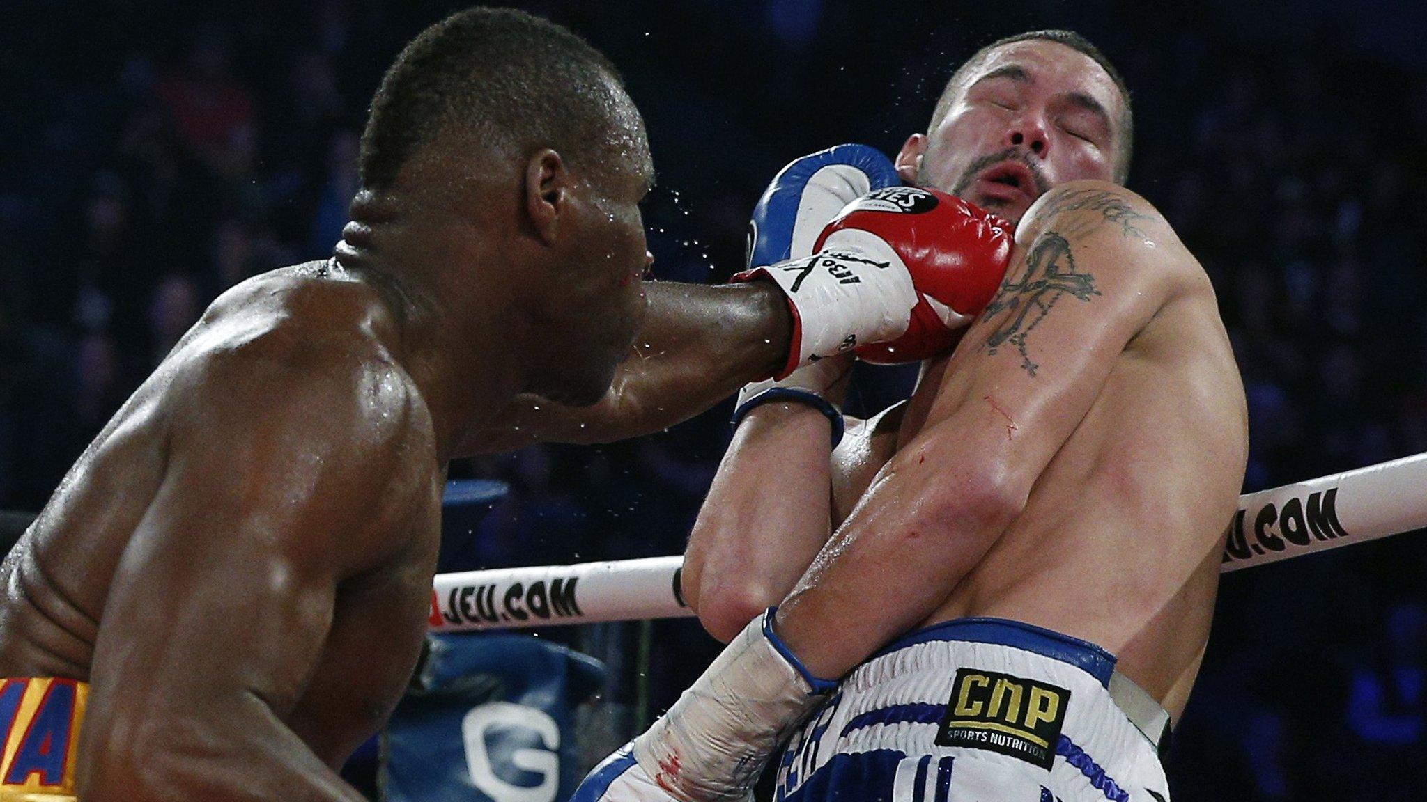 Tony Bellew (left) takes a punch from Adonis Stevenson