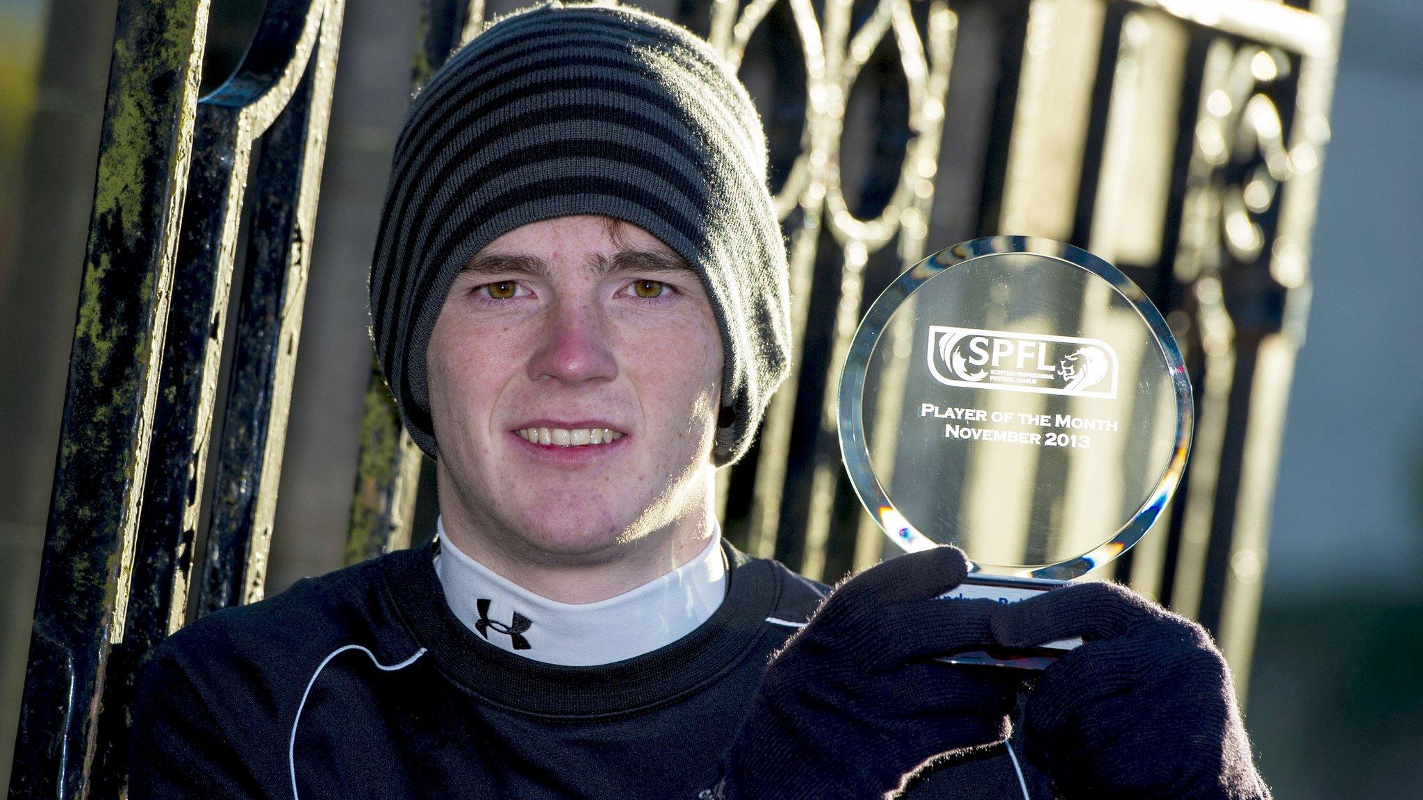 Dundee United defender Andrew Robertson with his SPFL player of the month award for November