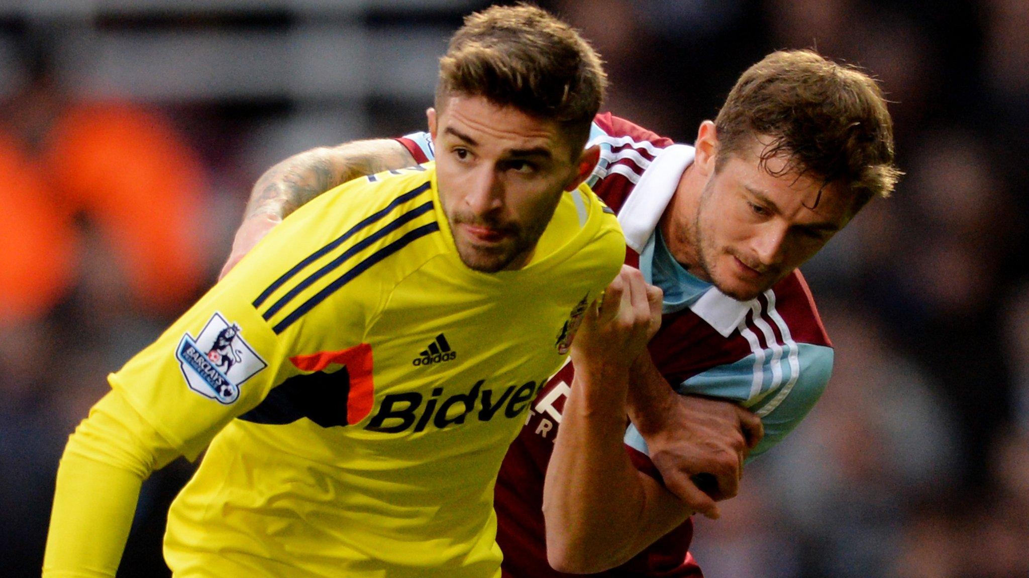 Sunderland ctriker Fabio Borini (left) and West Ham's George McCartney