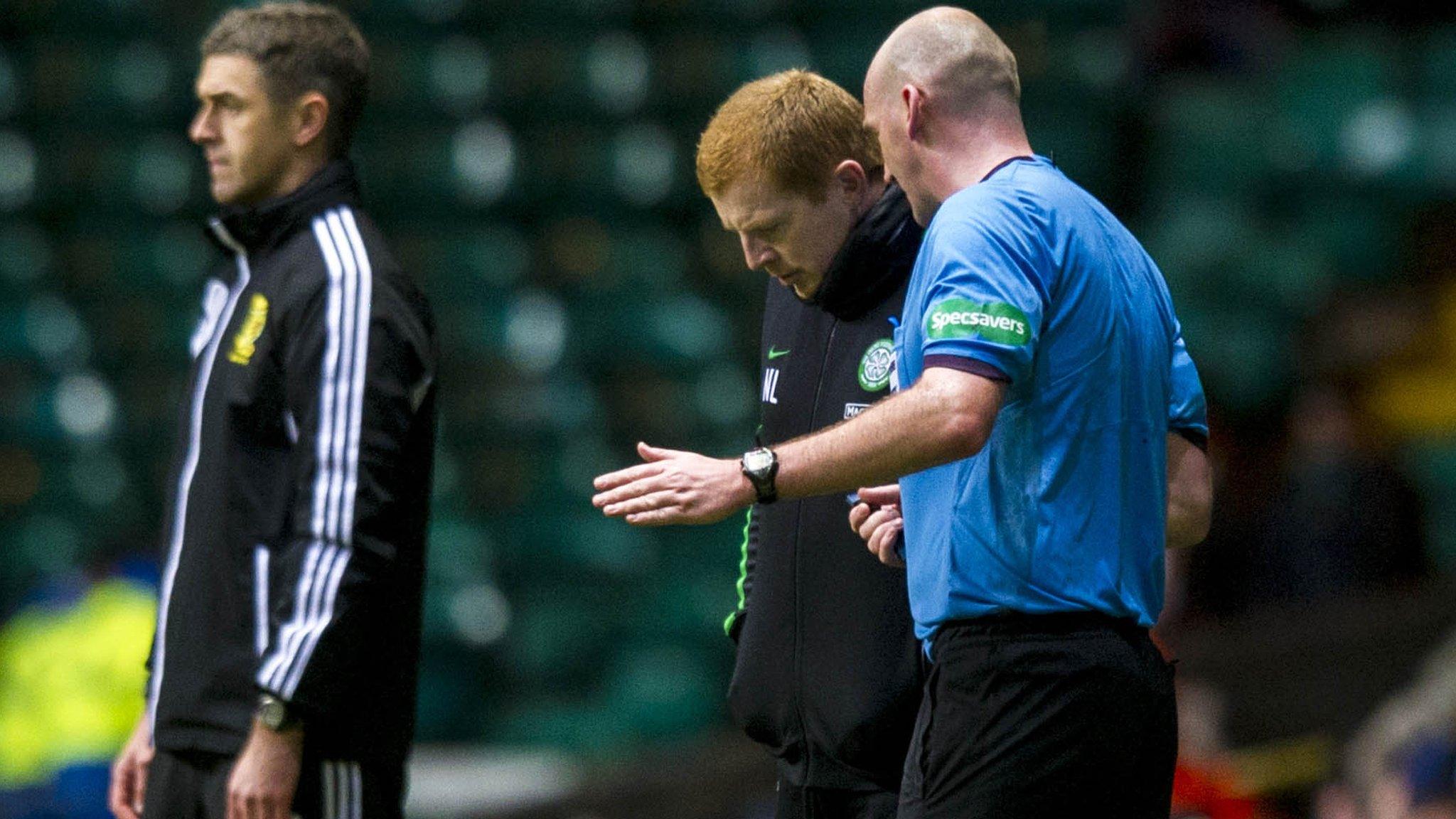 Referee Bobby Madden explains his decision to Celtic boss Neil Lennon