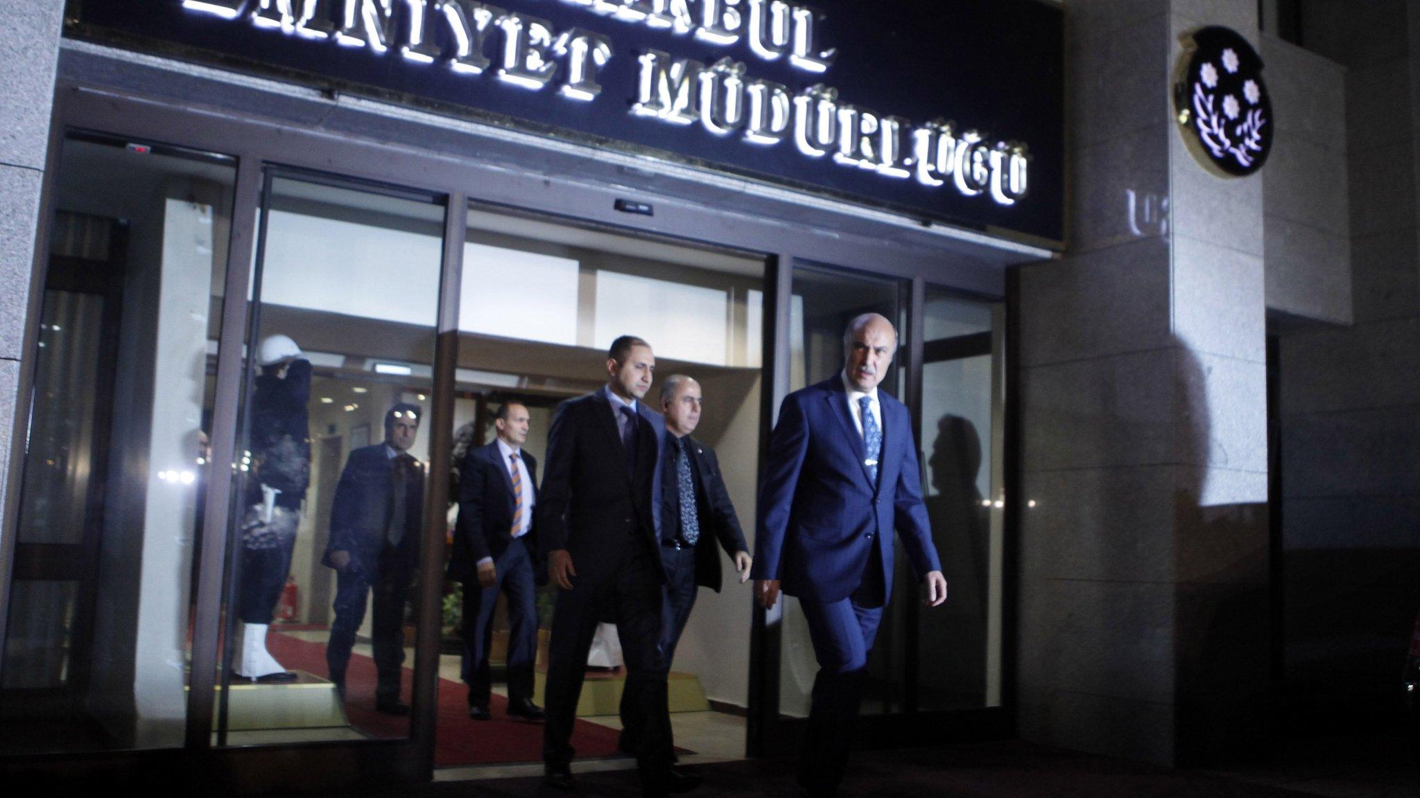 Istanbul police chief Huseyin Capkin (Front) leaves the police headquarters in Istanbul (18 December 2013)