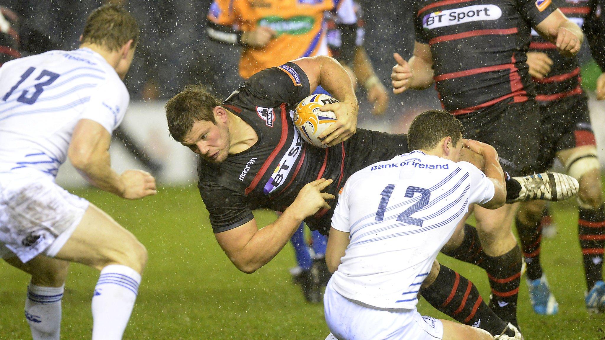 Edinburgh hooker Ross Ford is tackled by Leinster's Noel Reid