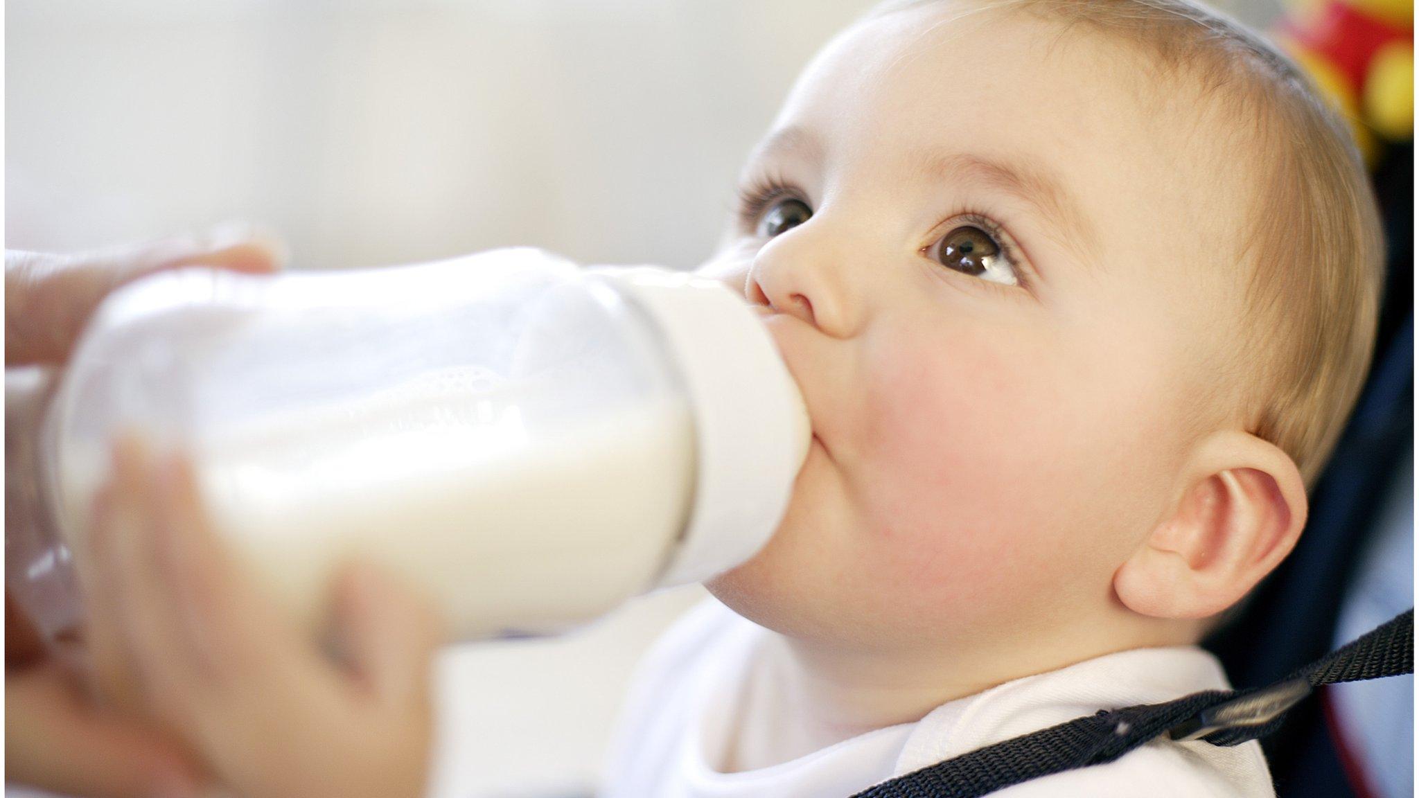 Baby drinking from a bottle