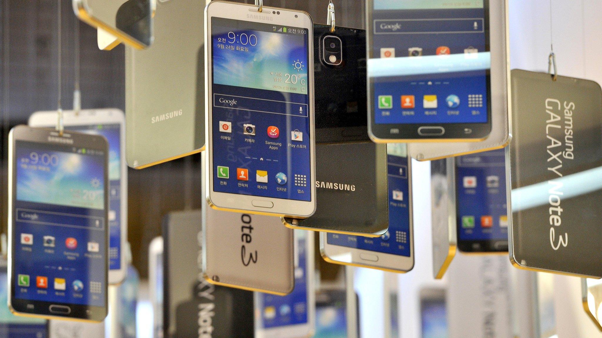 Cardboard cut-outs of Samsung Galaxy Note 3 on display