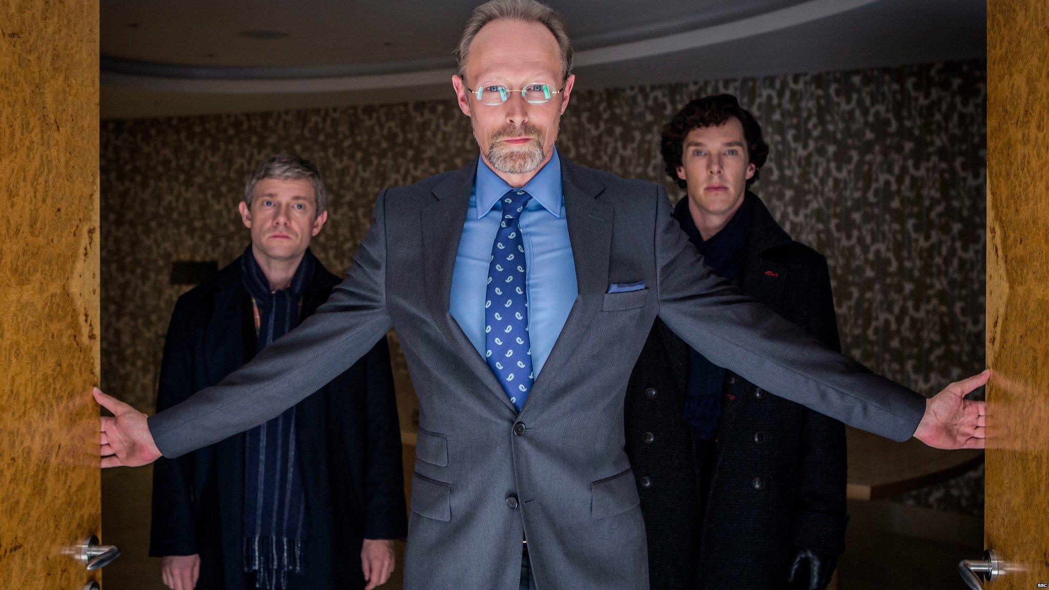 Martin Freeman as John Watson, Lars Mikkelsen as Charles Magnussen and Benedict Cumberbatch as Sherlock Holmes