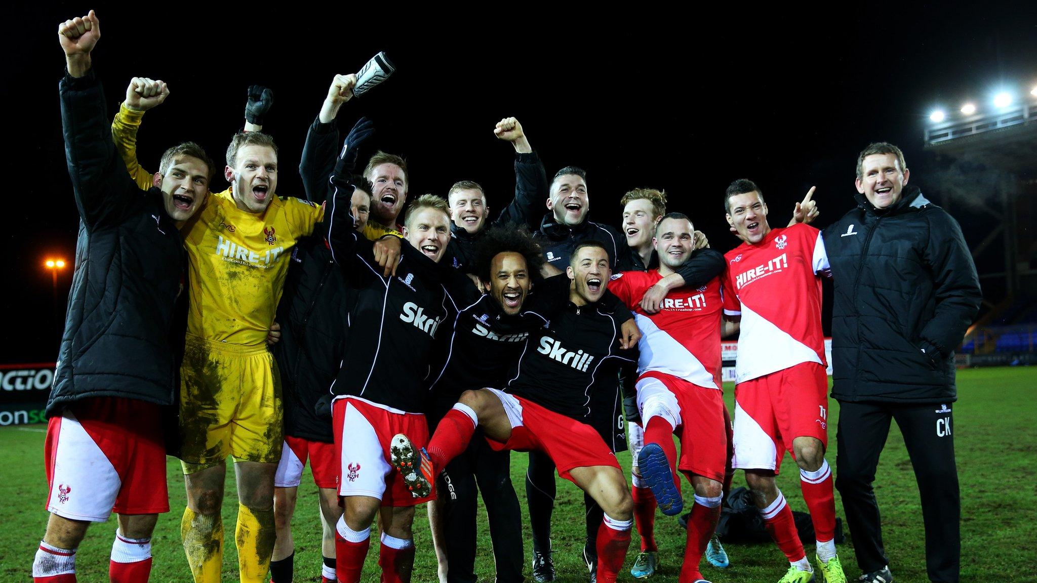 Kidderminster Harriers players celebrate victory against Peterborough.