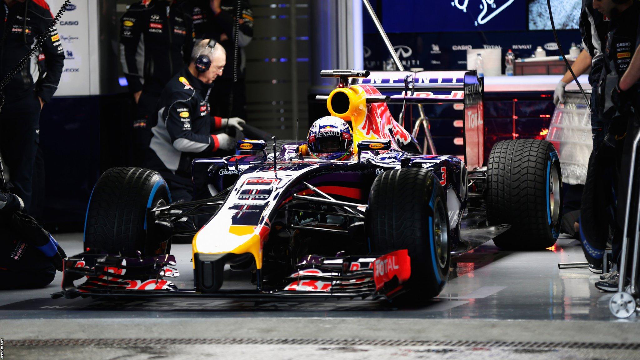 Red Bull's Daniel Ricciardo is pushed back into his team garage during testing in Jerez.