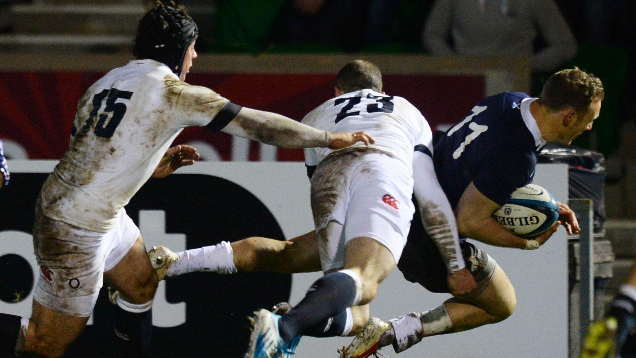 Byron McGuigan goes over to score for Scotland