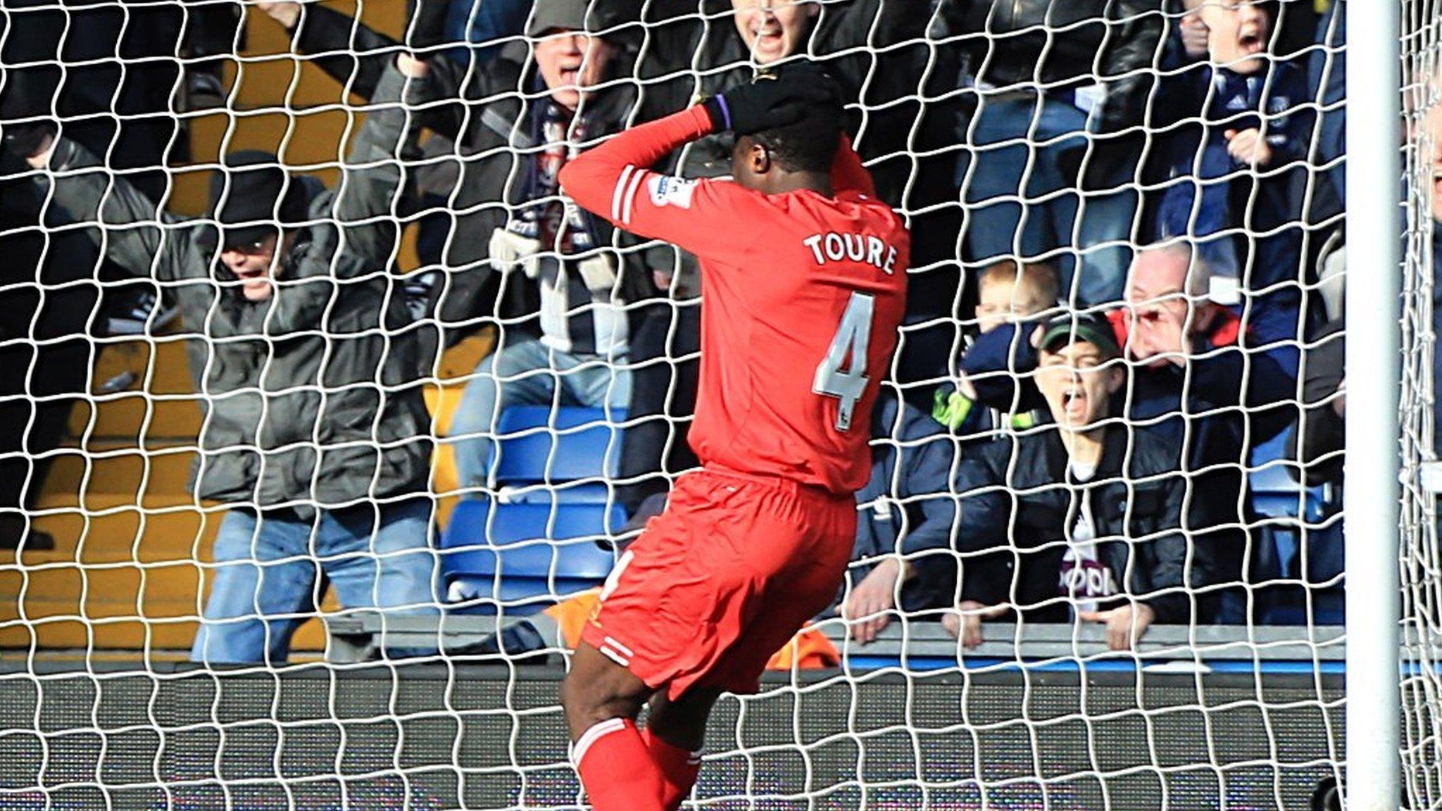 Liverpool defender Kolo Toure looks on after his mistake gifted West Brom an equaliser