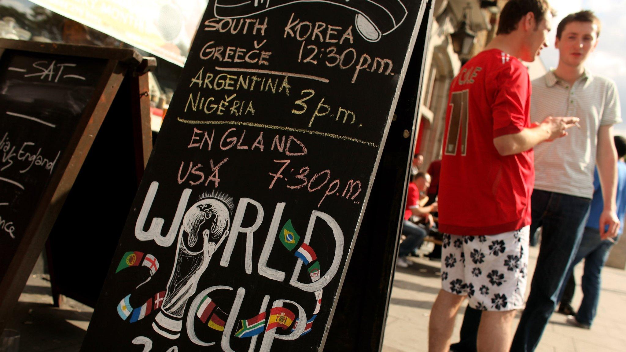 Football fans stood outside a pub