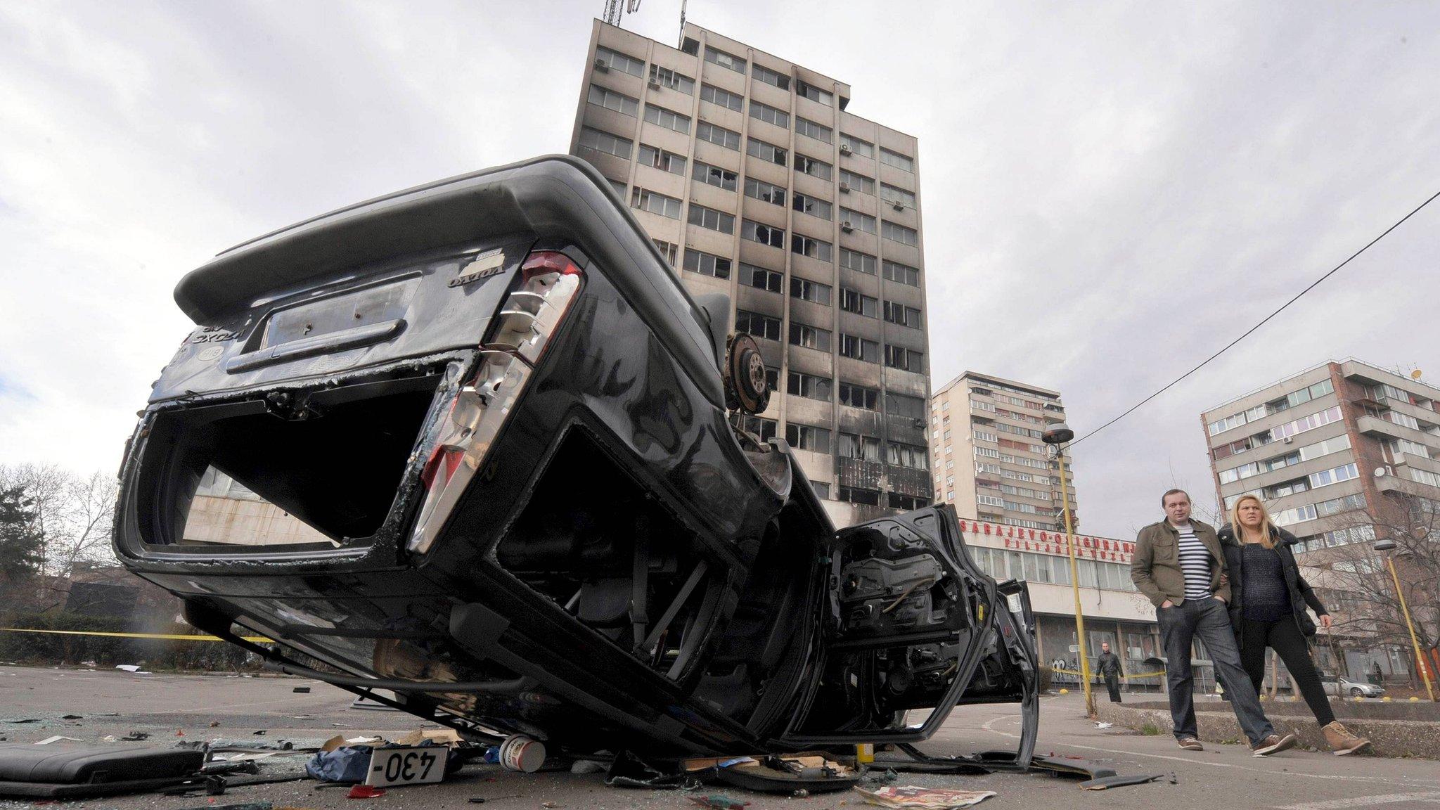 Wreckage and burned buildings in Tuzla, Bosnia, on 8 February 2014