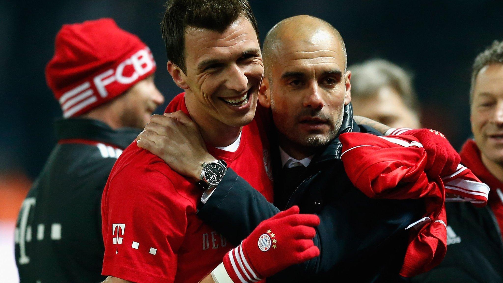 Pep Guardiola (right) celebrates winning the Bundesliga title