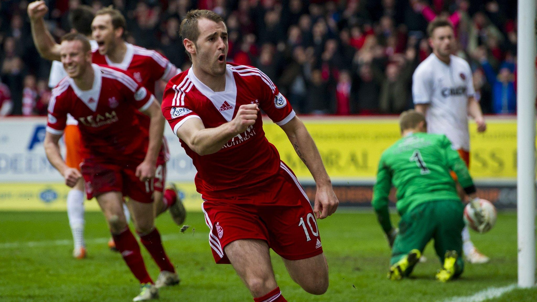 Niall McGinn celebrates his equaliser