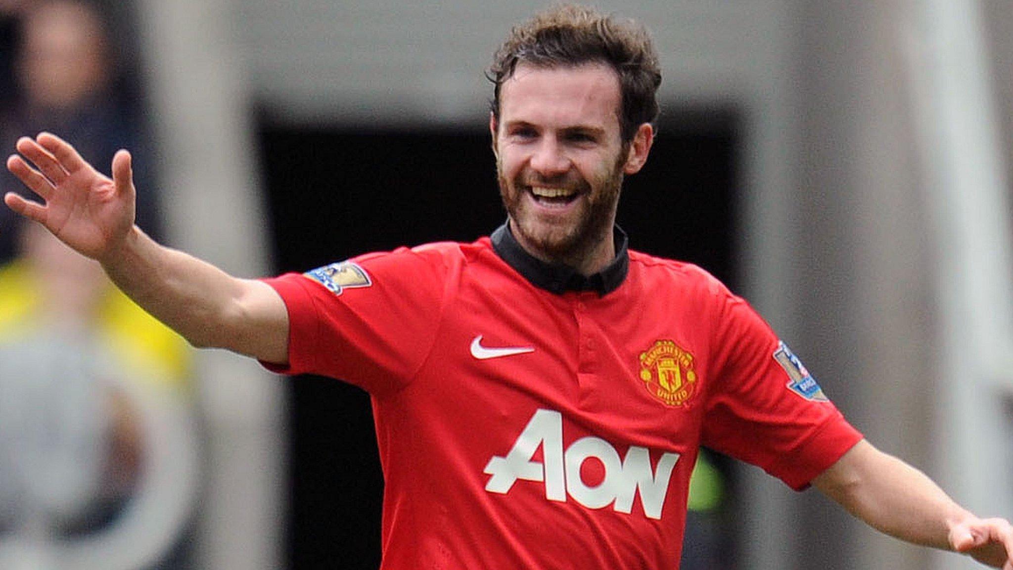 Juan Mata (right) celebrates giving Manchester United the lead at Newcastle