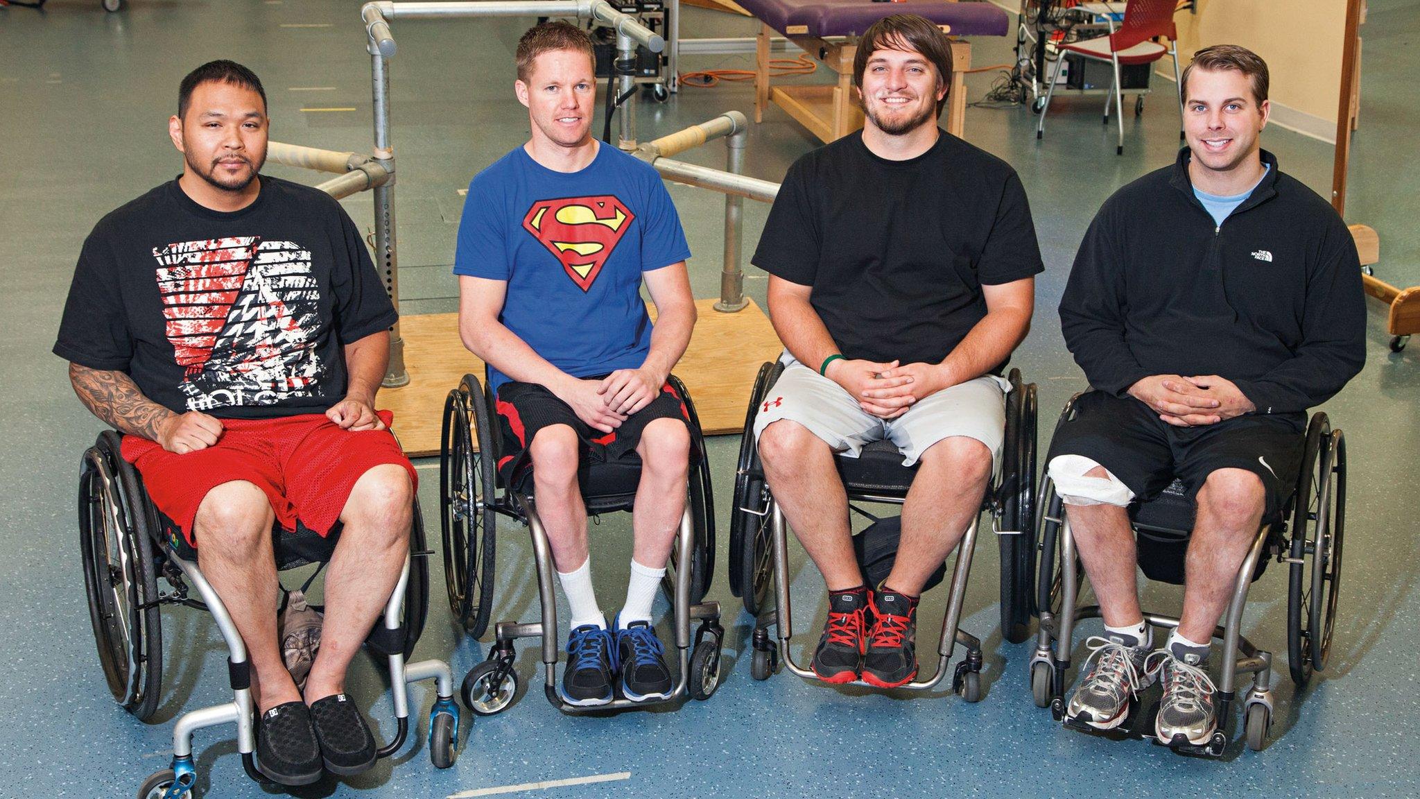 Four men in wheelchairs