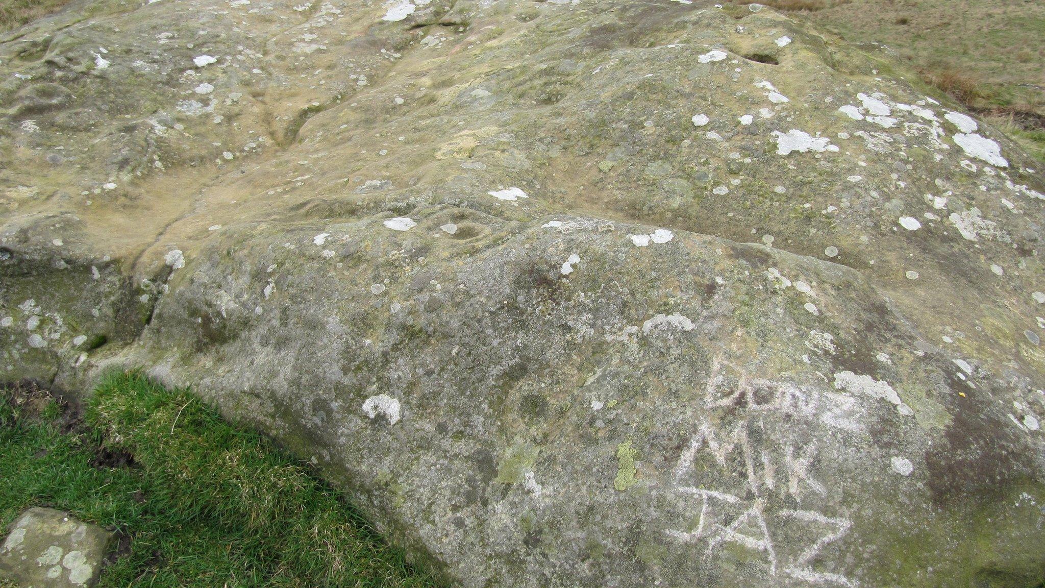 Damaged cup and ring stone