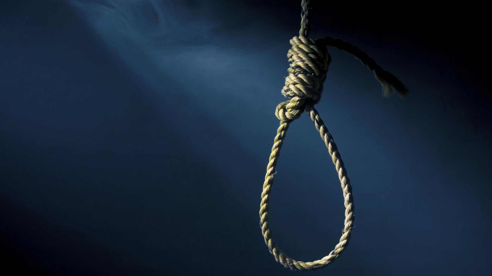 A noose on a dark background