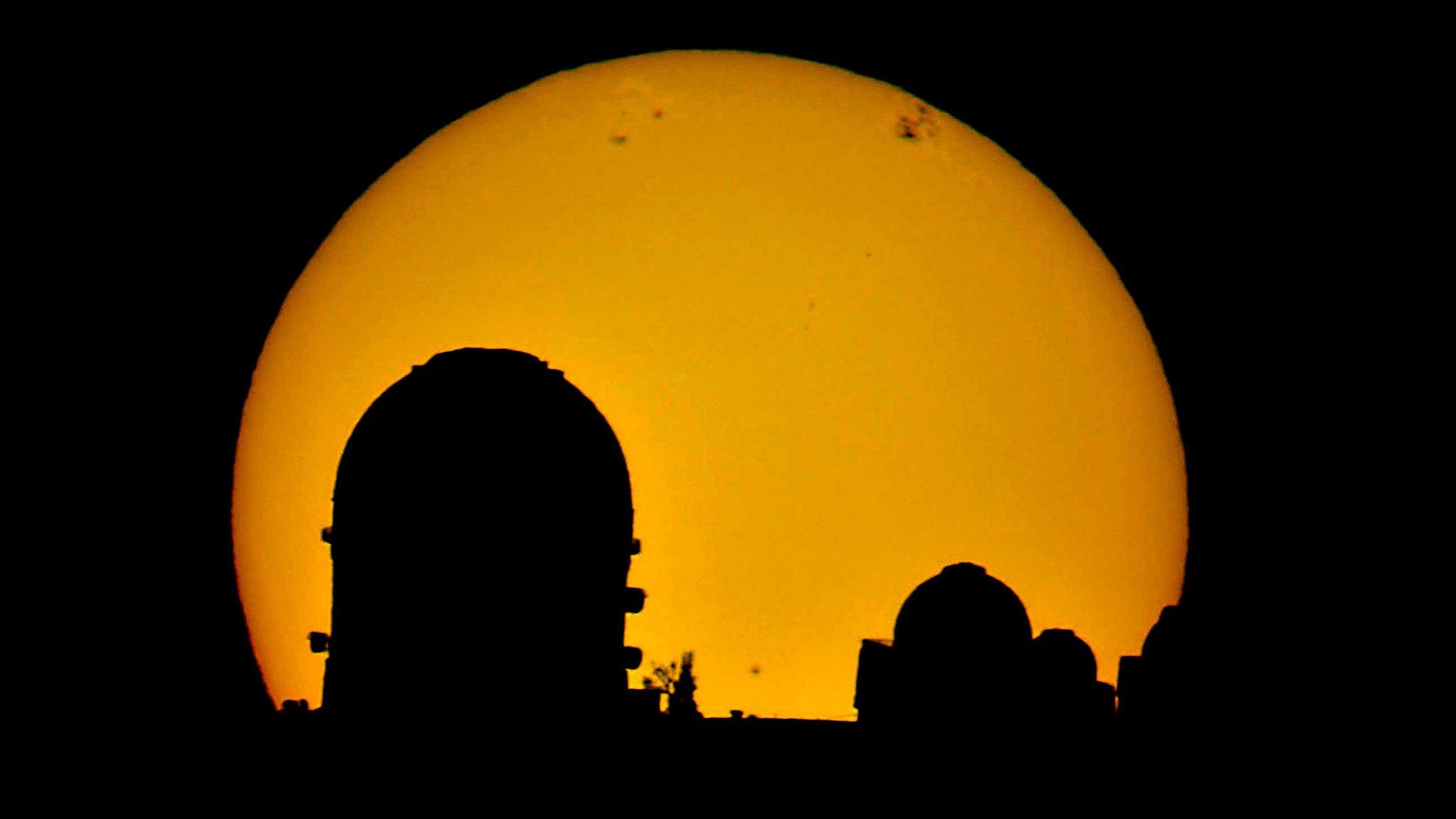 Observatory in Chile with sun in the background