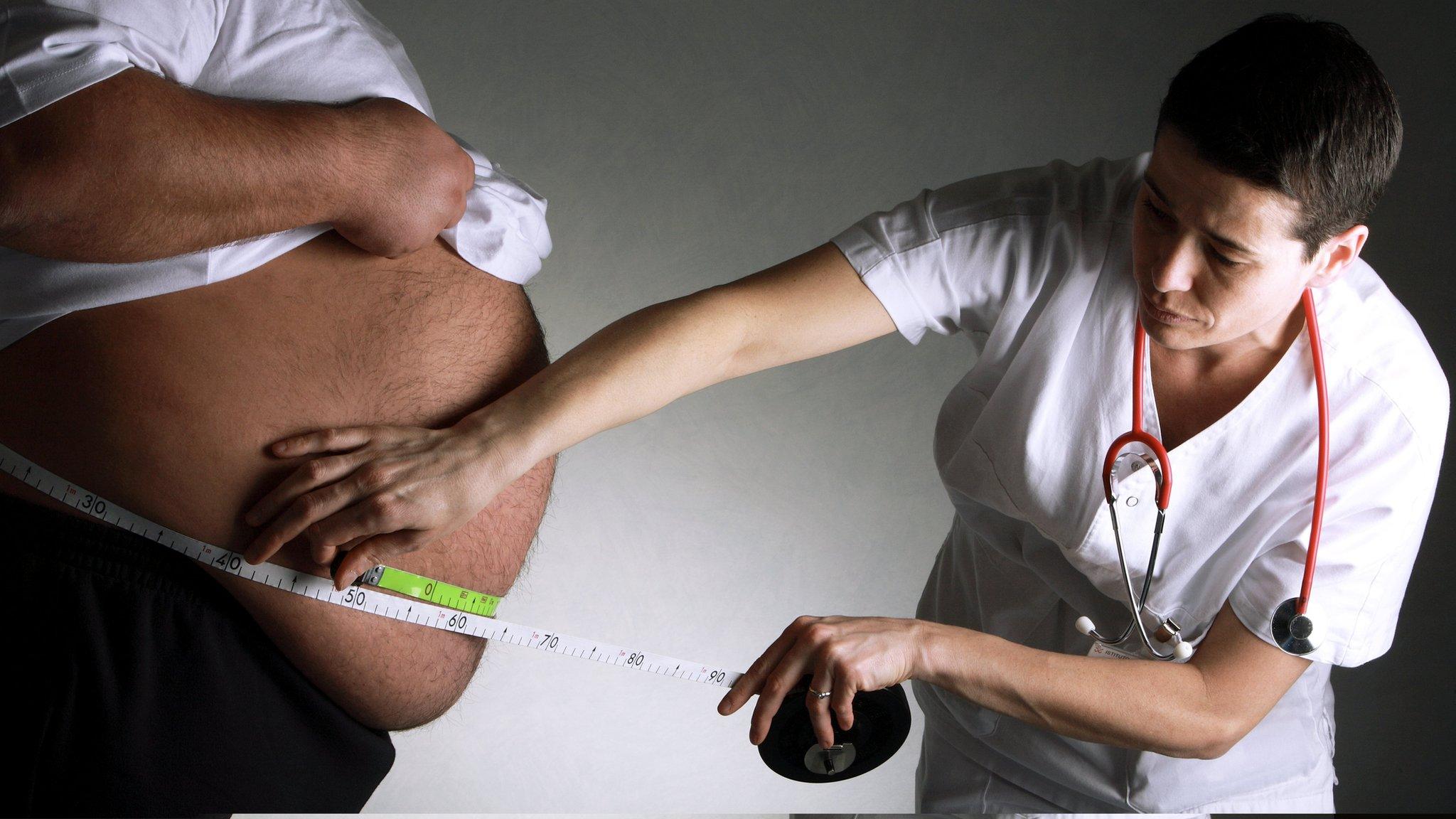 Obese patient being measured