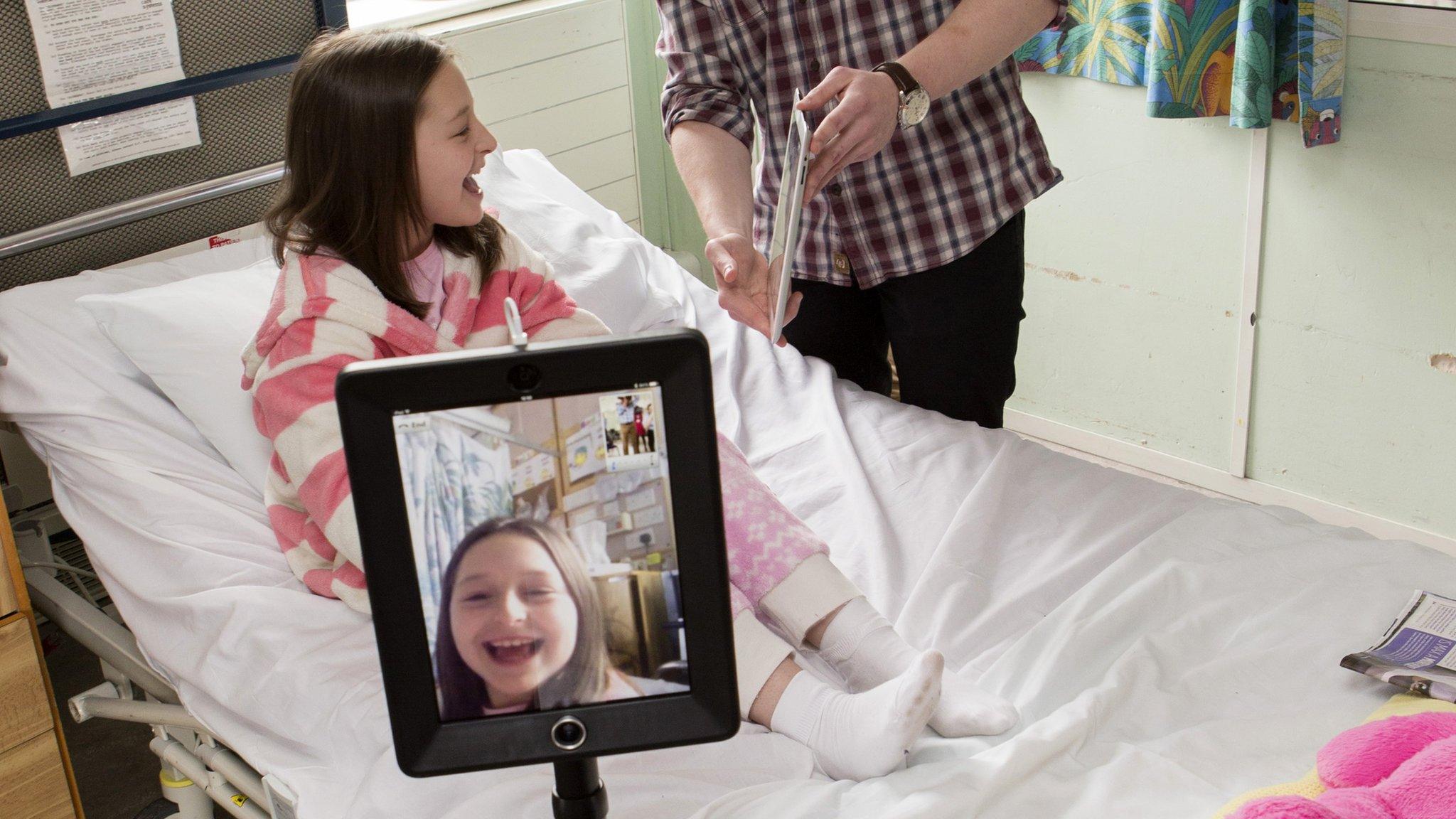 Child at Alder Hey hospital, Liverpool using an interactive robot